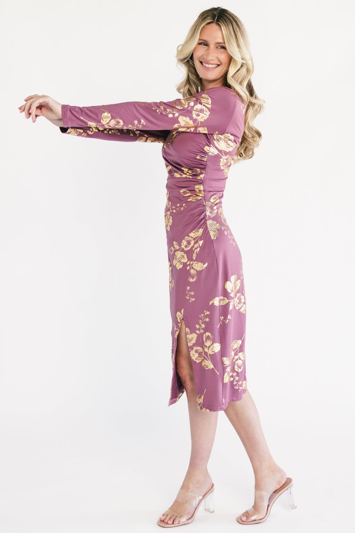 Back view of Valeria Midi Dress showing scoop back, hidden back zipper, and the subtly shimmering gold floral accents against the black base.