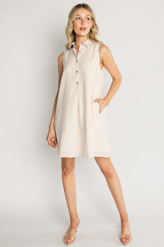 Front view of the Dolly Short Dress in beige and ivory gingham on a model, showing collared neckline, three-button front, left chest pocket, and swing hem.