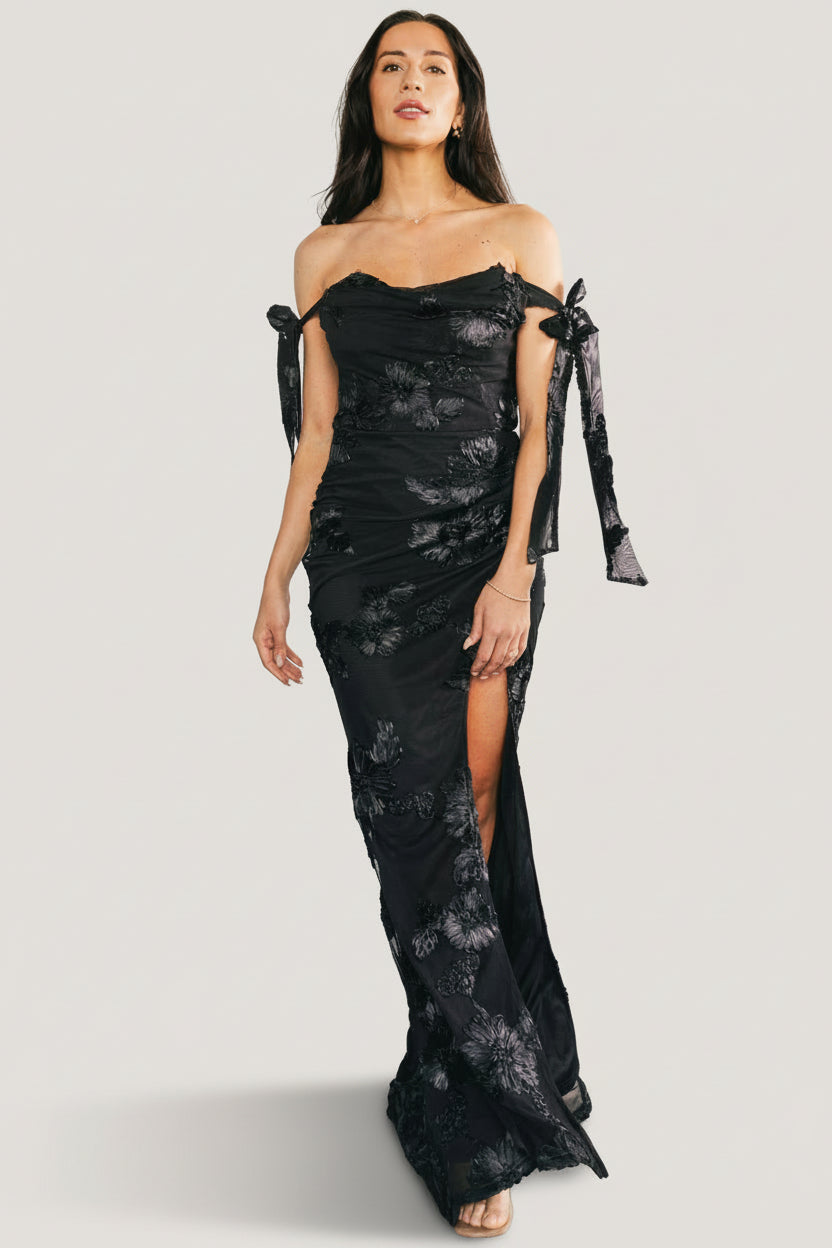 Rear and side view showing hidden side zipper, adjustable bow strap tie, and fully lined construction of the Kinsley maxi dress.
