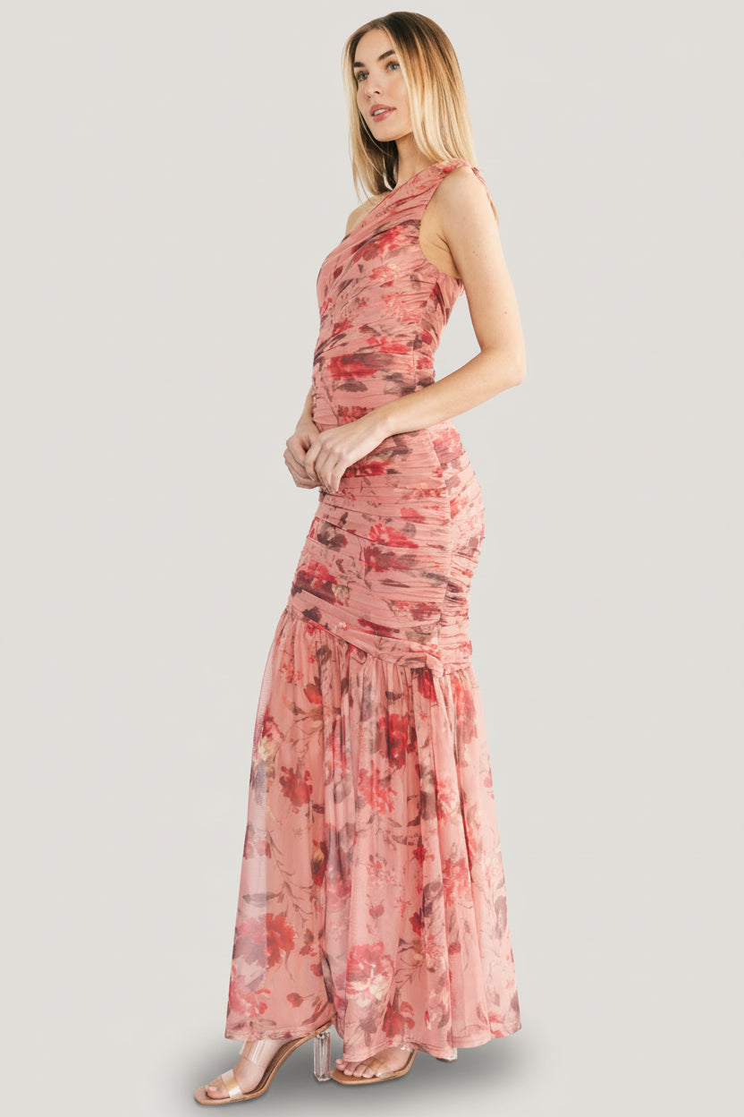 Studio portrait of the Emeline dress angled to show the one-shoulder neckline, ruched bodice and overall feminine silhouette.