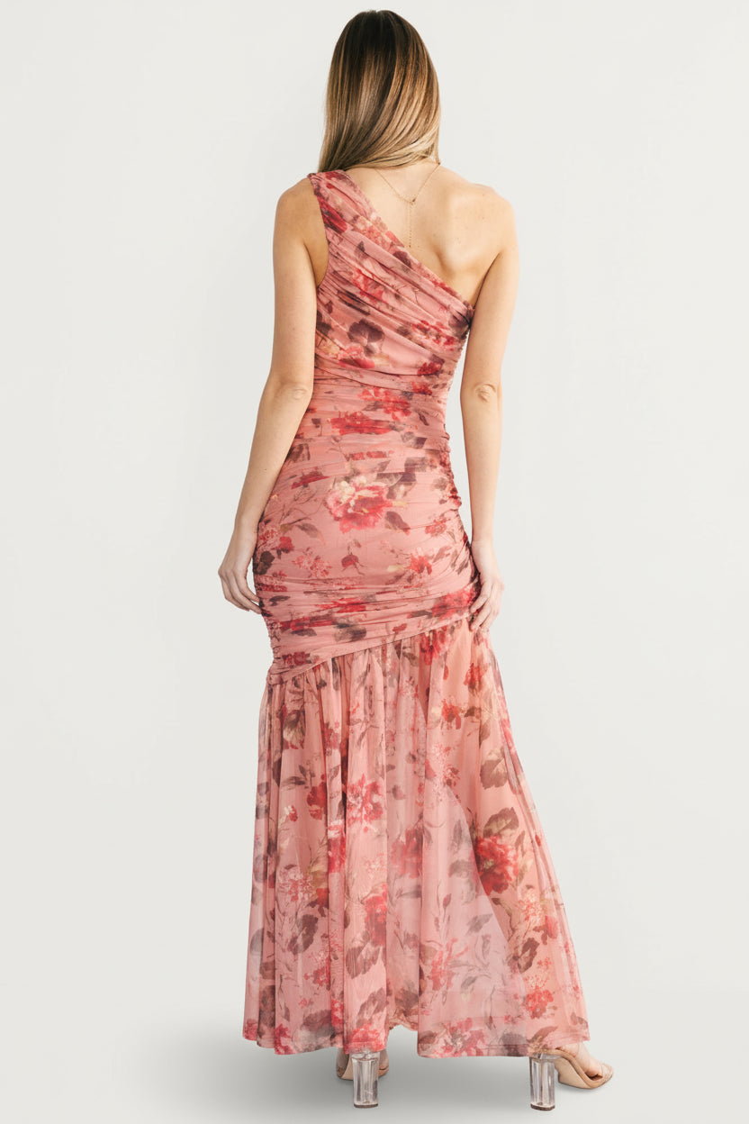 Full-length back view of the Emeline maxi dress showing the unlined mermaid hem and floral print movement on the skirt.