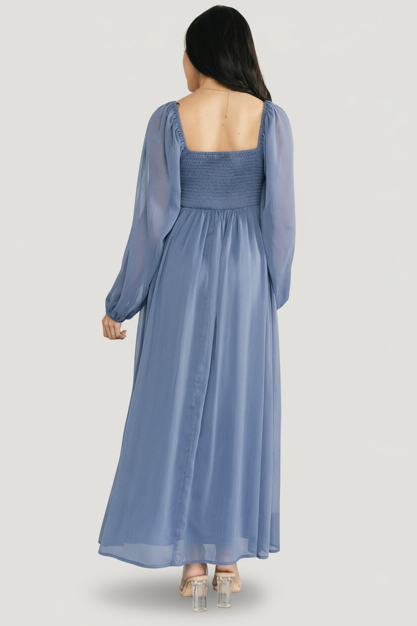 Back view of the Dione midi dress showing smocked back panel and how the lined bodice meets the flowy skirt.