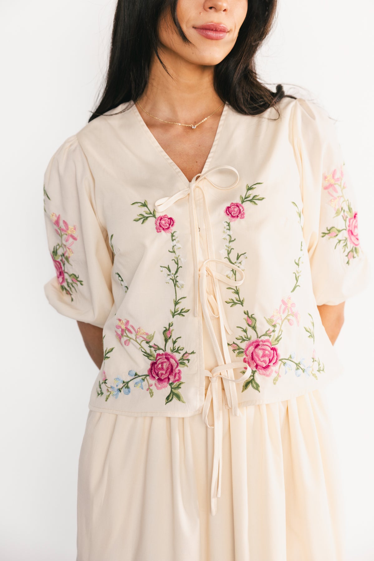 Back view showing elasticated back waist of the skirt and how the tiers fall, plus the hidden snap closure on the top.