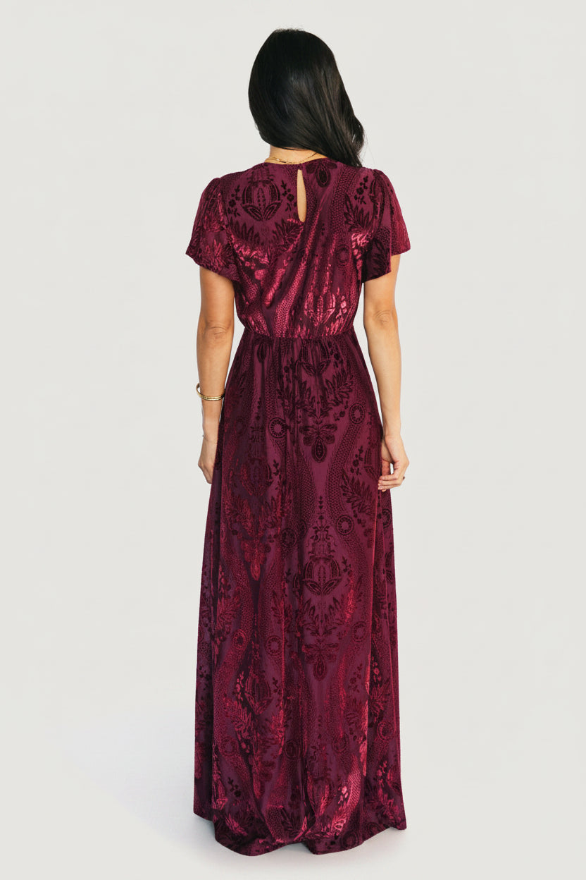 Close-up detail of wine burnout floral velvet showing mesh overlay, soft stretch shell, and rich monochromatic texture.