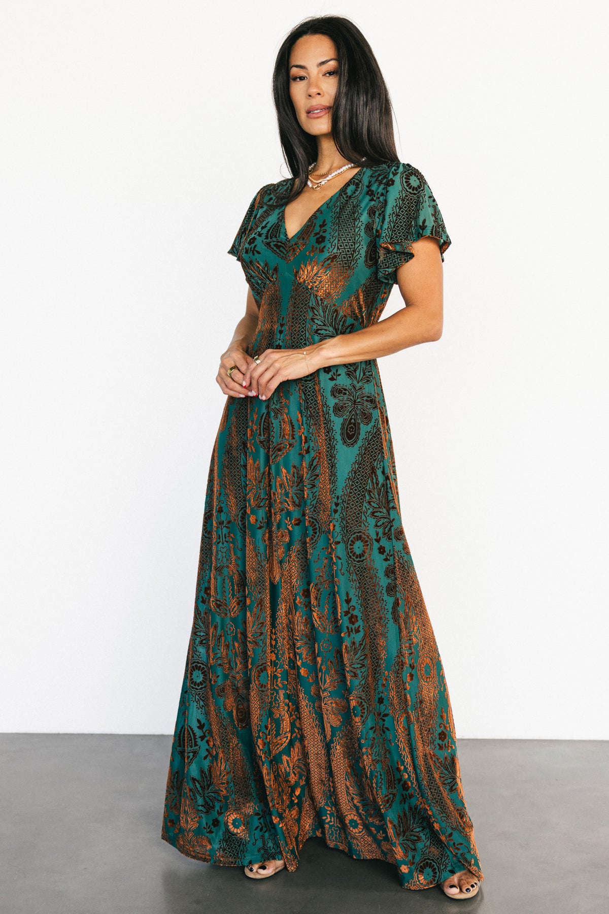 Styled flat-lay and hanging shot of the Kimberly velvet maxi dress showing full length, lining, and velvet pattern.