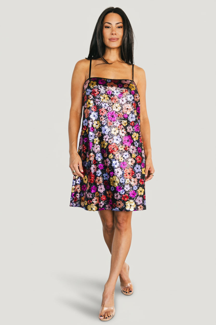 Front view of the Malia Sequin Mini Dress in Black Multi on a model, showing multicolor floral sequins, boxy shift silhouette, and adjustable tank straps.