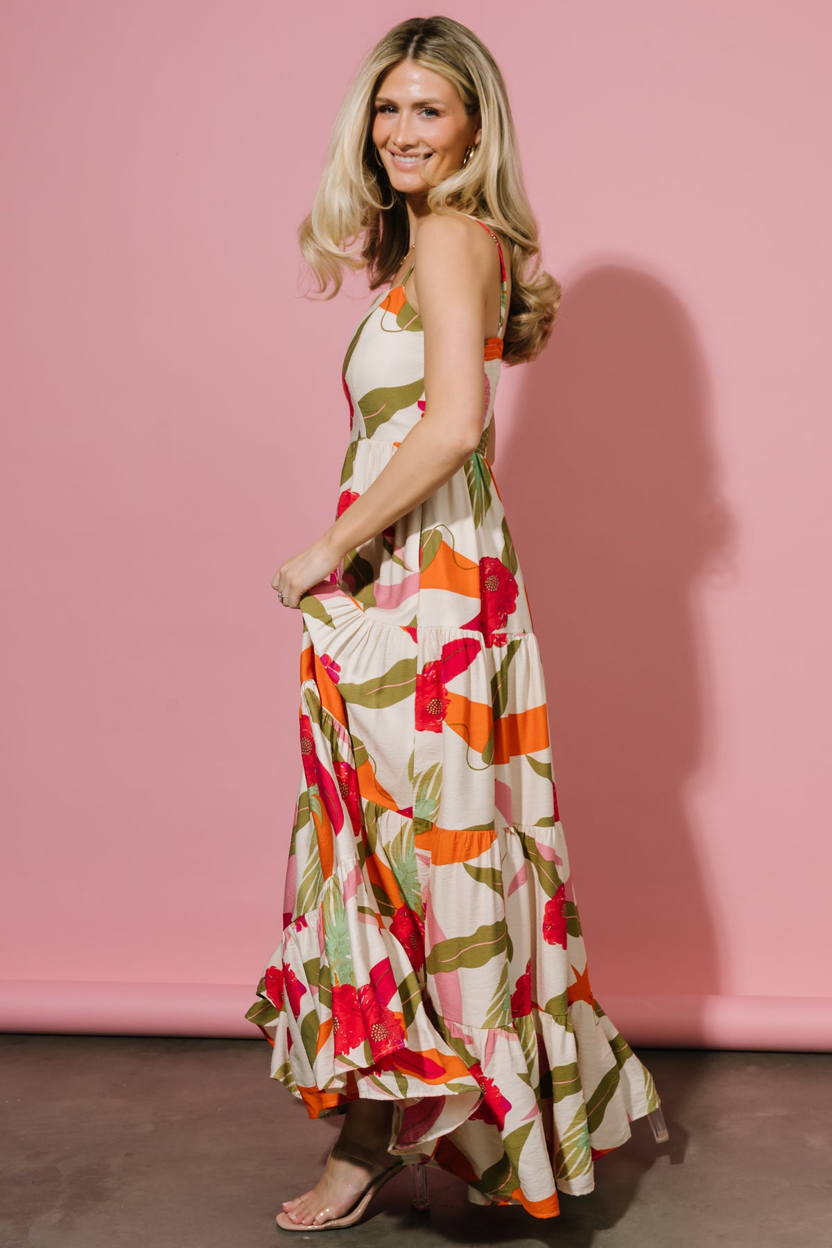Detail image of tiered skirt and hidden side seam pocket illustrating functional design and layered silhouette.