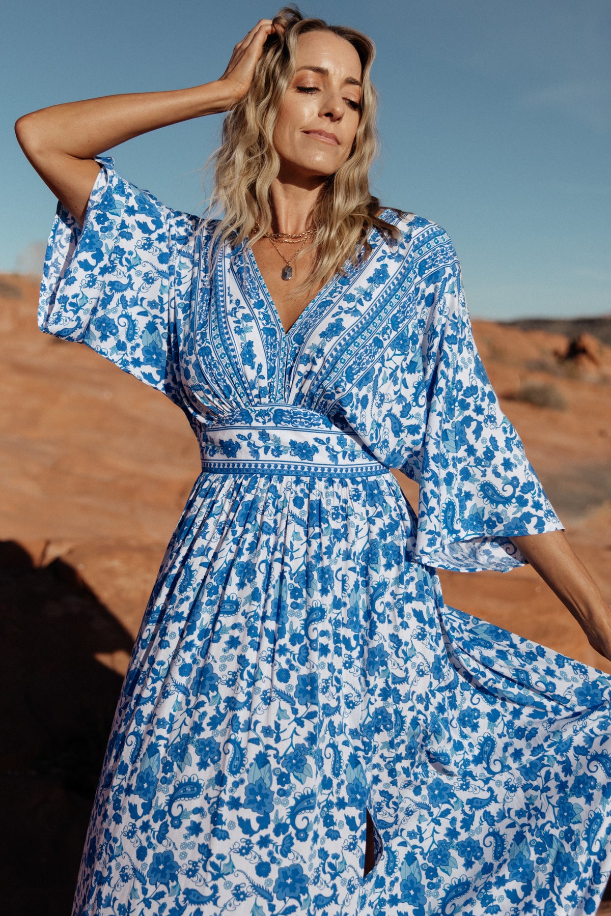 Side view of the Watson kimono maxi dress on model, highlighting V-neck, kimono sleeves and flowing maxi length.