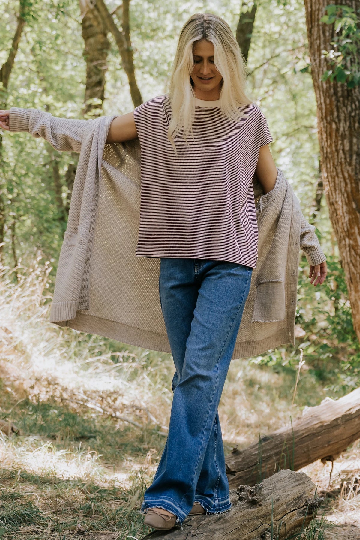 Bria High Rise Wide Leg Jeans in Medium Wash with relaxed wide legs, front and back pockets, button closure, and raw hem.