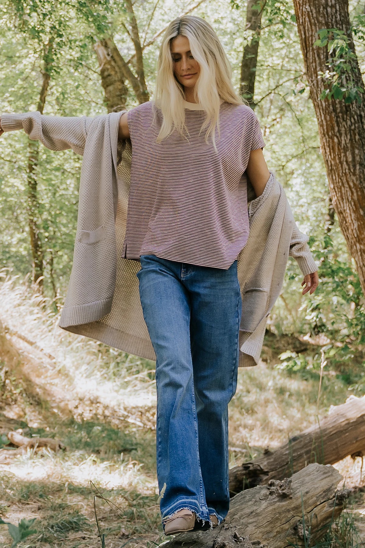 Bria High Rise Wide Leg Jeans in Medium Wash with relaxed wide legs, front and back pockets, button closure, and raw hem.