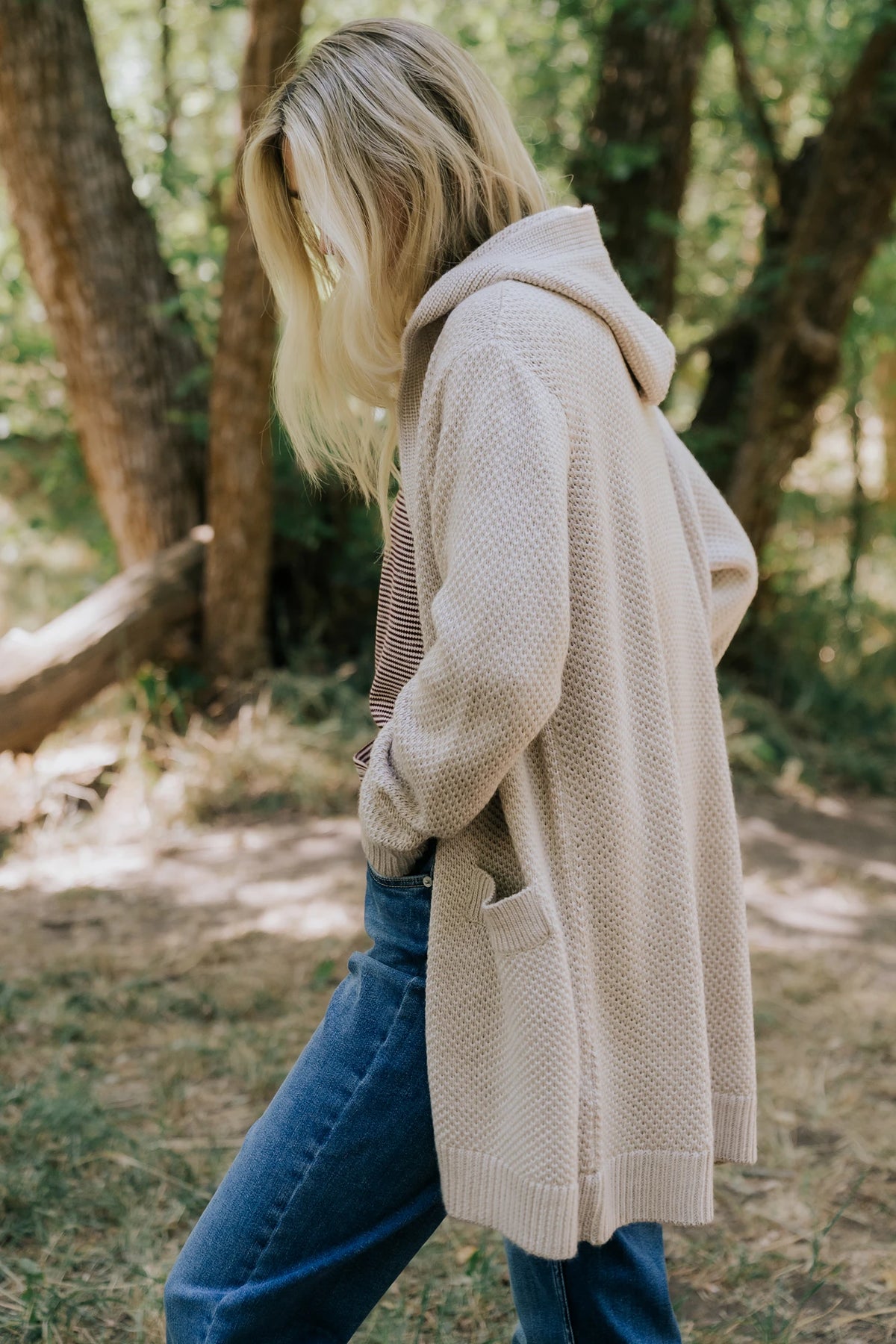 Katrine Hooded Cardigan with chunky knit, oversized fit, four-button front, patch pockets, and ribbed trim.