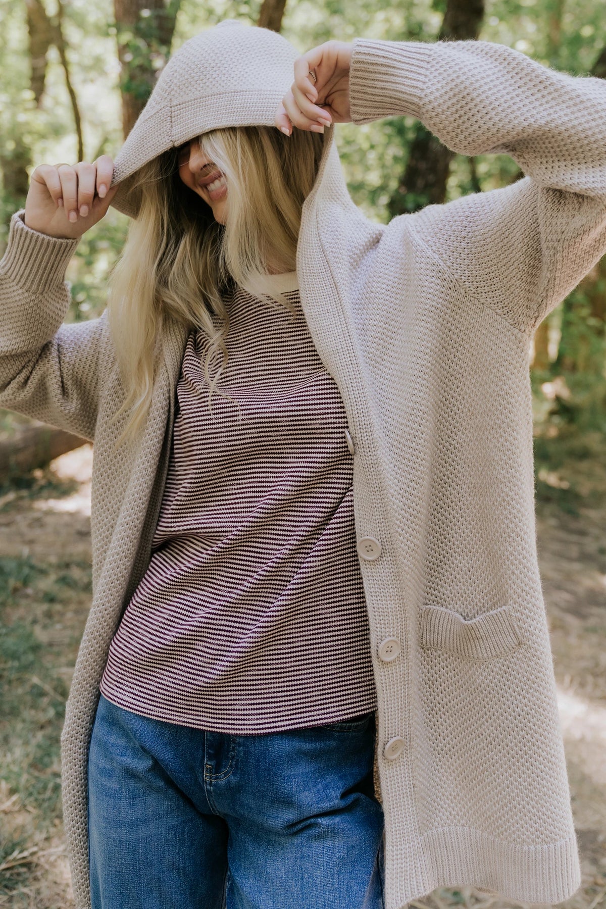 Katrine Hooded Cardigan with chunky knit, oversized fit, four-button front, patch pockets, and ribbed trim.