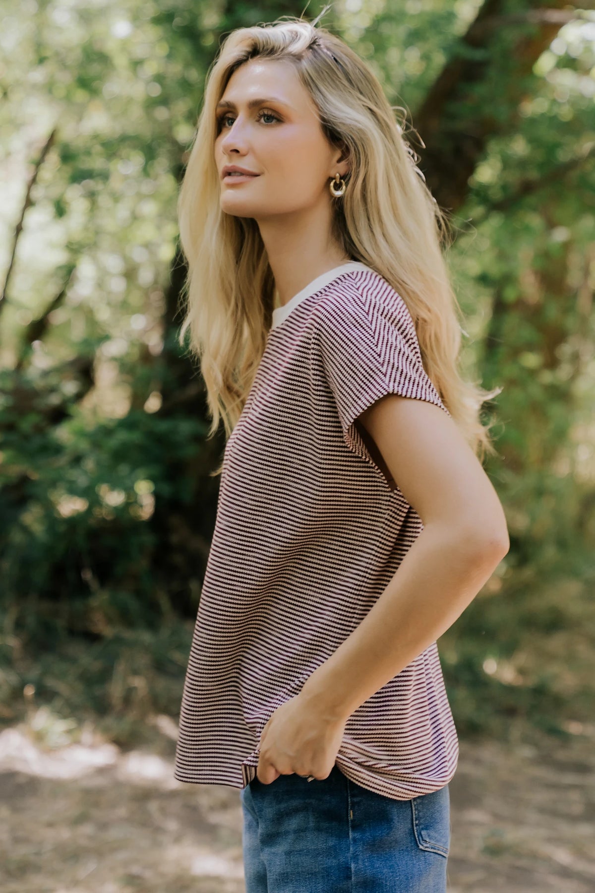 Millie Striped Top in Burgundy + Ivory with round neckline, short sleeves, side slits, and asymmetrical hem.