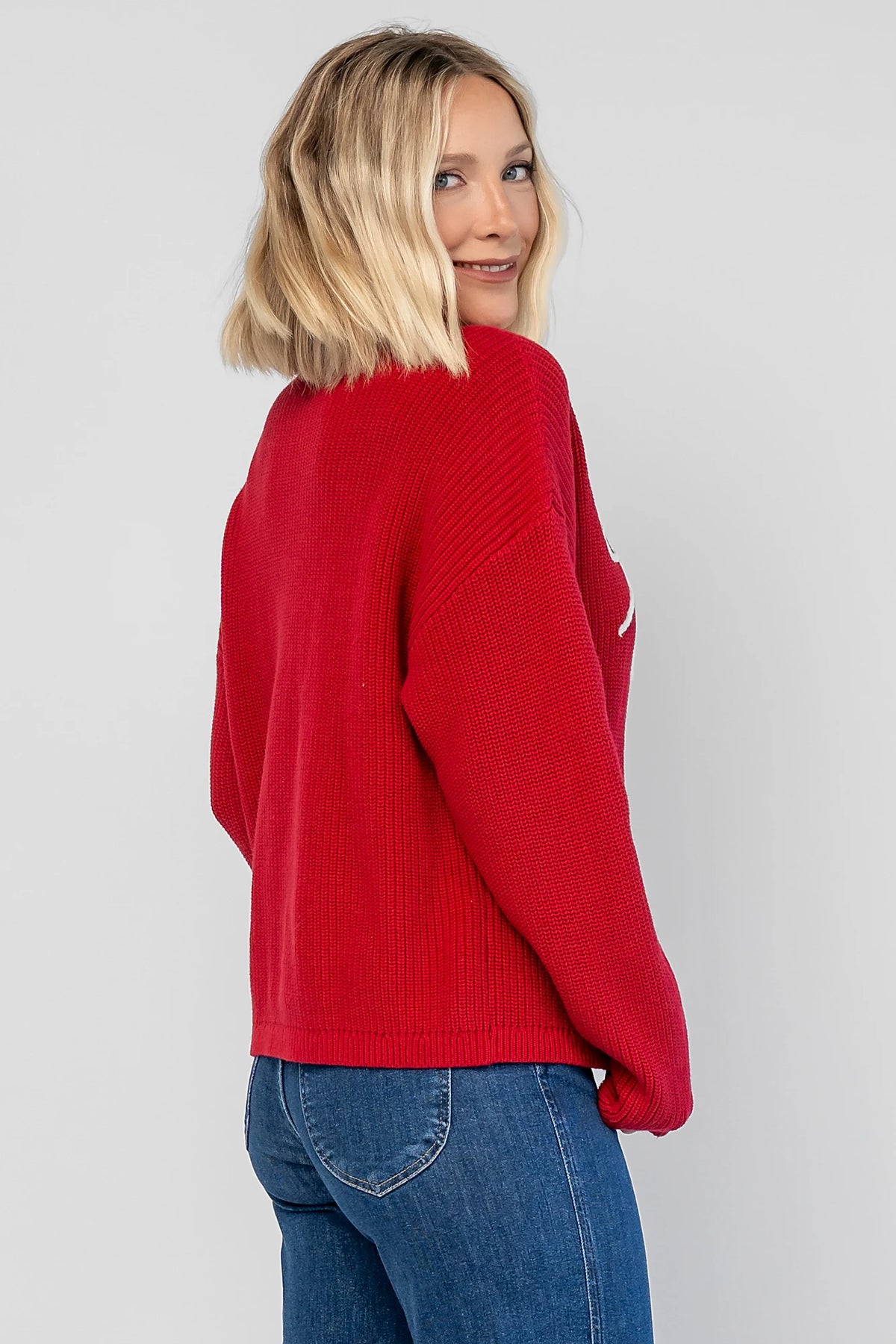 Merry Sweater in Red + Off White with a crew neckline, soft knit fabric, and embroidered Merry & Bright graphic.