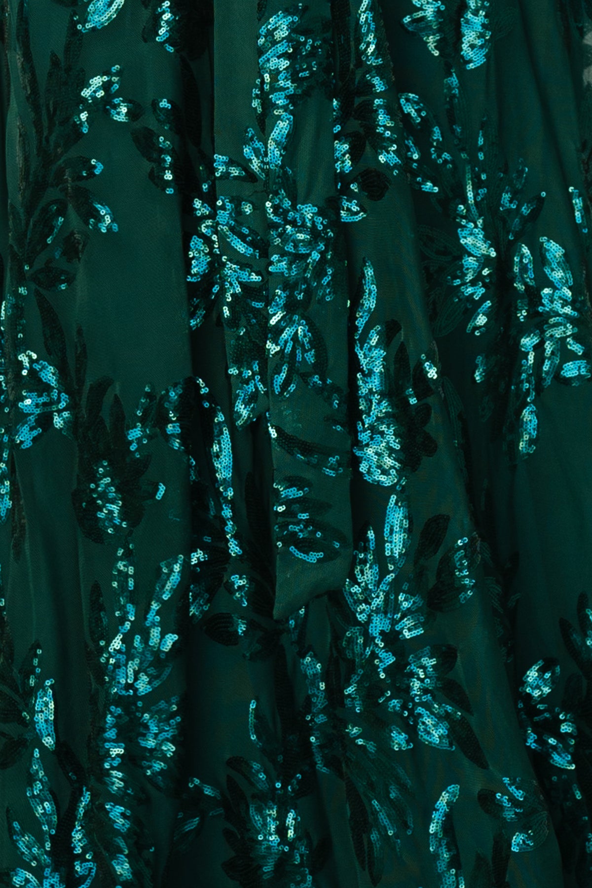 Emerald Muse Sequin fabric swatch close-up showing dense green sequins and reflective texture with leaf-like sequin pattern, 3x4 inch sample.