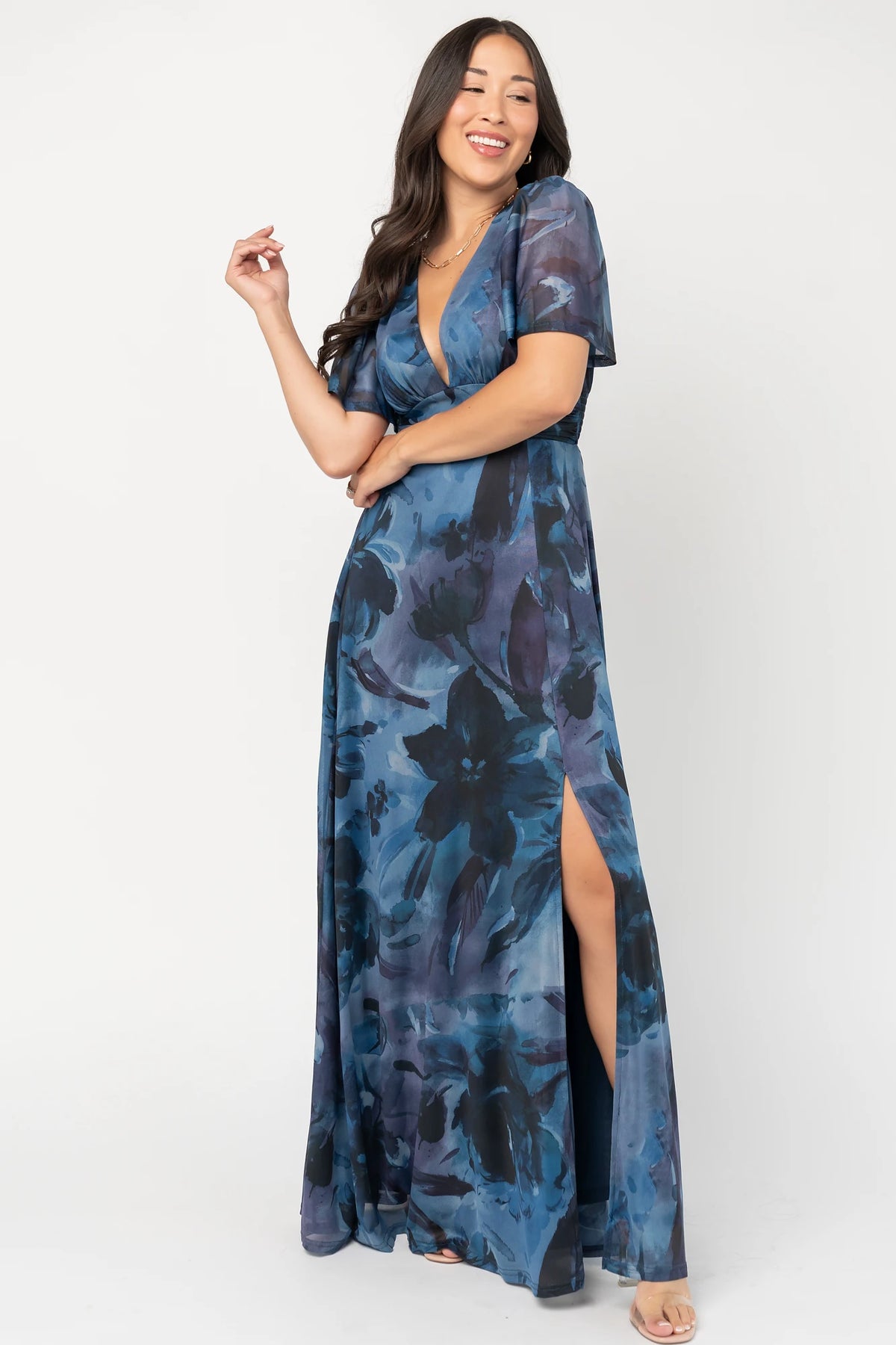 Arianne Mesh Maxi Dress in Midnight Floral with deep V-neck, flutter sleeves, empire waist, floral print, and leg slit.