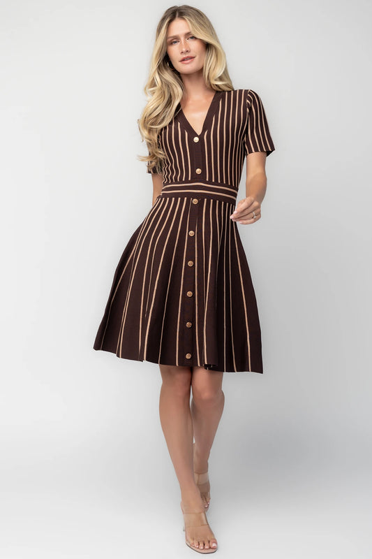 Model wearing the Tate Striped Short Dress in Brown + Beige featuring a soft sweater knit with beige vertical stripes.