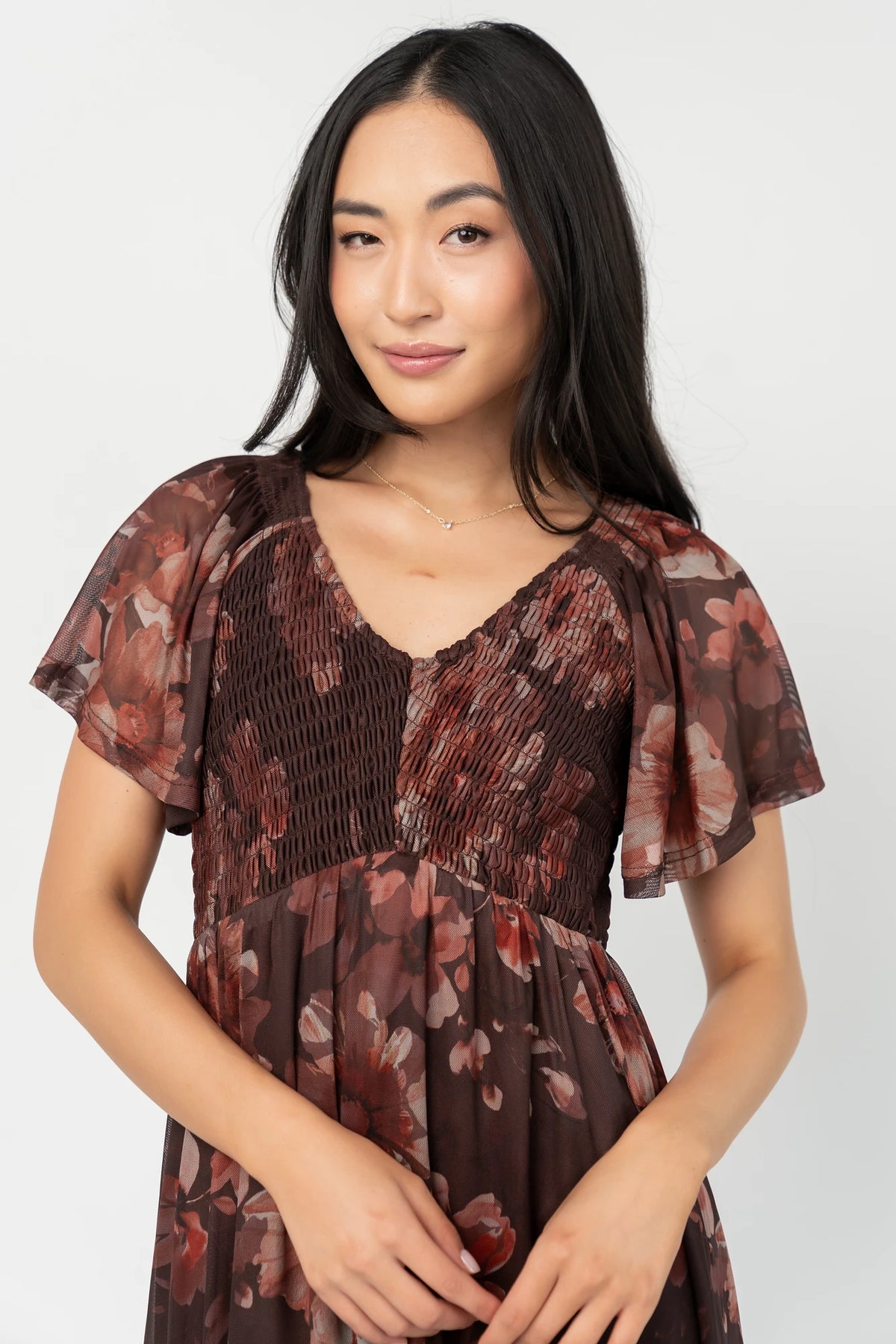Livia Mesh Midi Dress in Brown + Rust Floral with V-neckline, smocked bodice, flutter sleeves, and tiered hem.