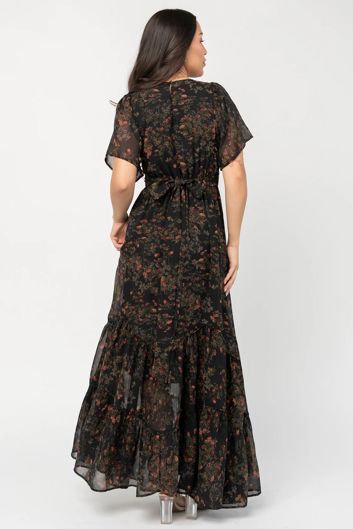 Katherine Maxi Dress in Black Multi Print with surplice V-neck, flutter sleeves, adjustable waist ties, and tiered skirt.