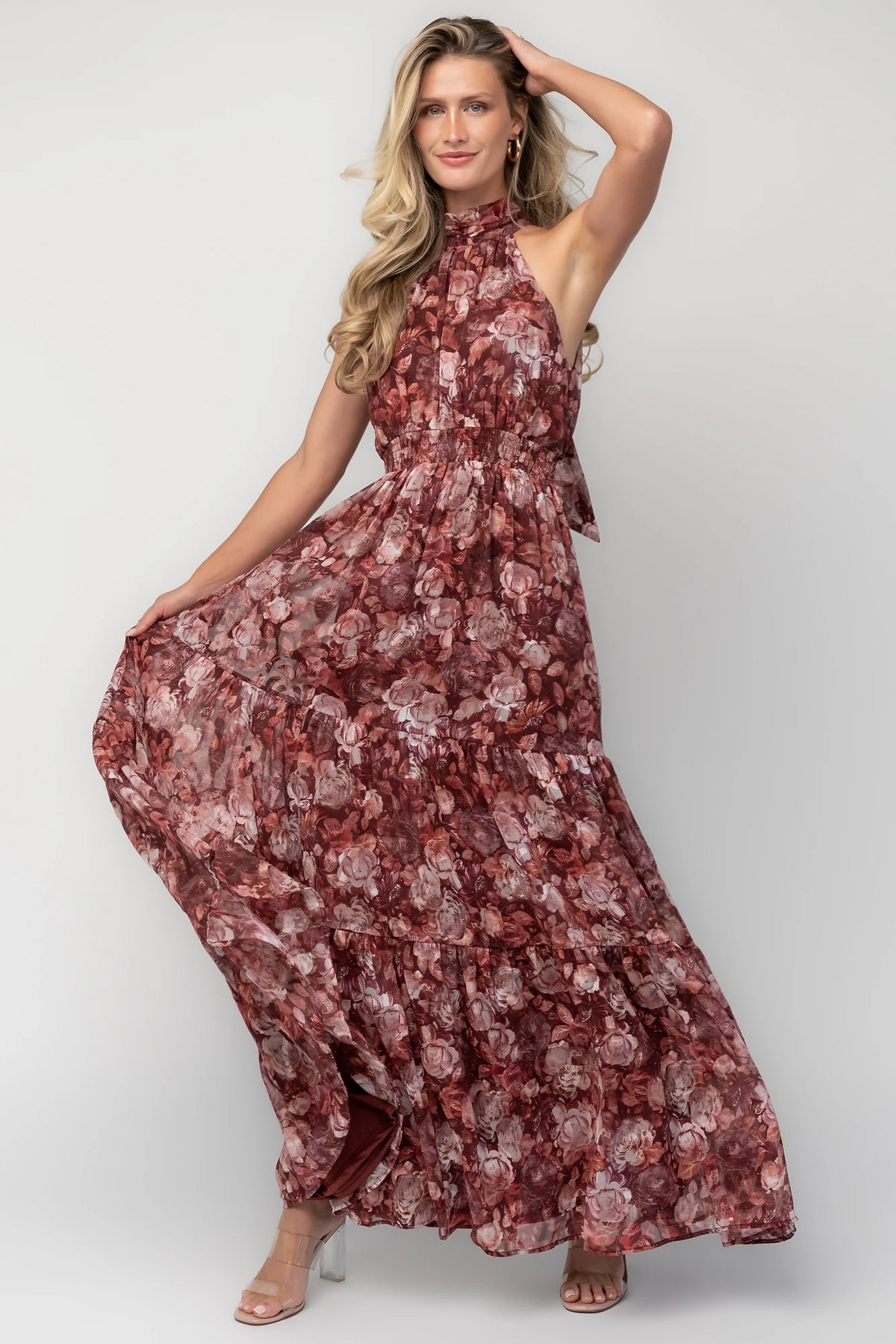 Model wearing the Pulitzer Maxi Dress in Burgundy Floral featuring a rich burgundy floral print on lightweight burnout chiffon. 