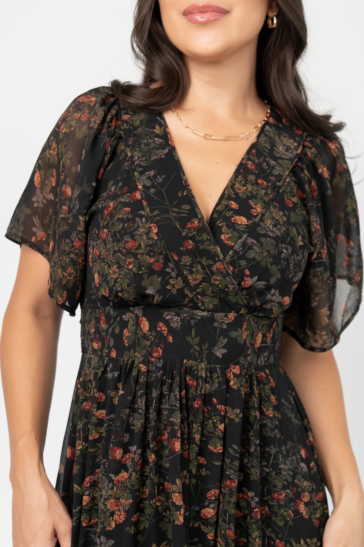 Katherine Maxi Dress in Black Multi Print with surplice V-neck, flutter sleeves, adjustable waist ties, and tiered skirt.