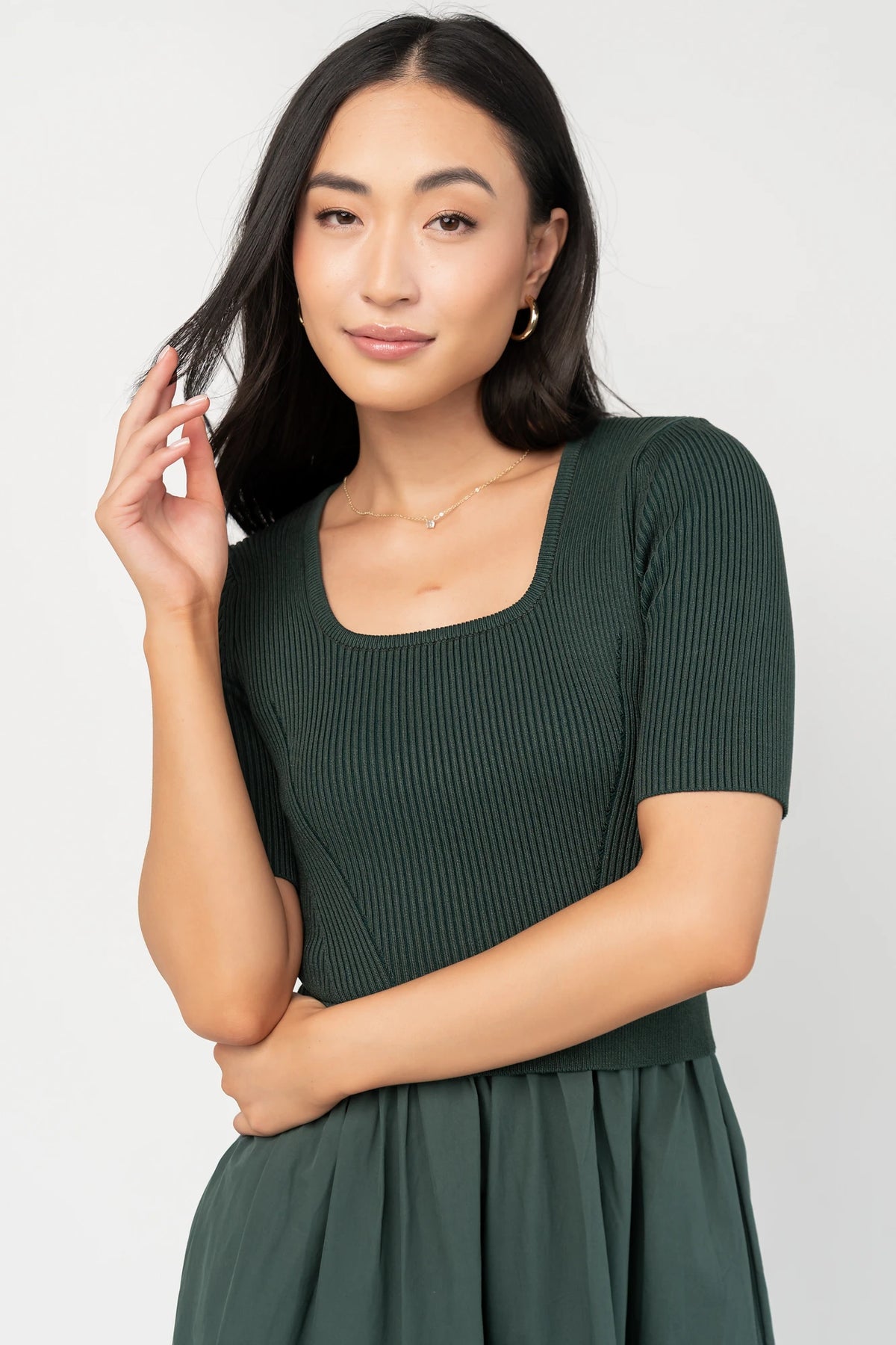 Astra Tiered Dress in Winter Green with ribbed knit bodice, scoop neckline, short sleeves, and tiered cotton skirt.