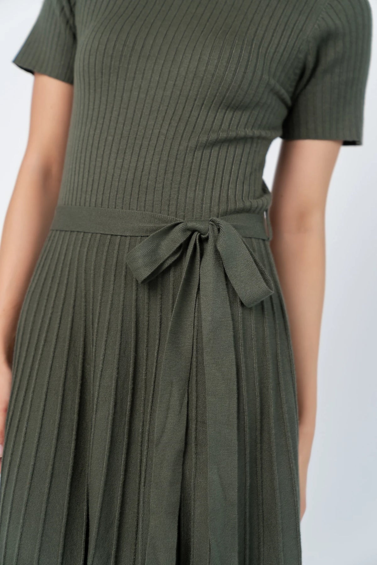 Jessamine Midi Dress with ribbed sweater knit, crew neckline, short sleeves, self-tie waist belt, and pleated skirt.