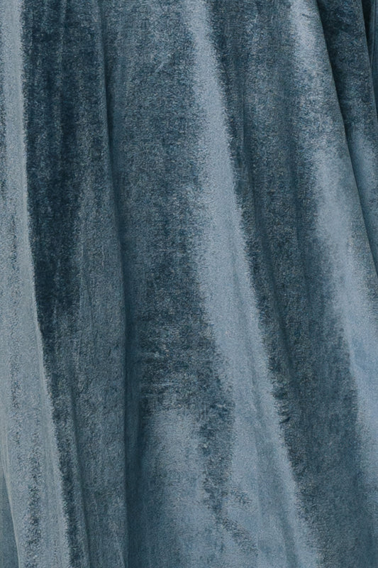 Blue Katelyn Velvet fabric swatch laid flat on white background showing pile texture, subtle sheen, and slight stretch for color matching and drape.
