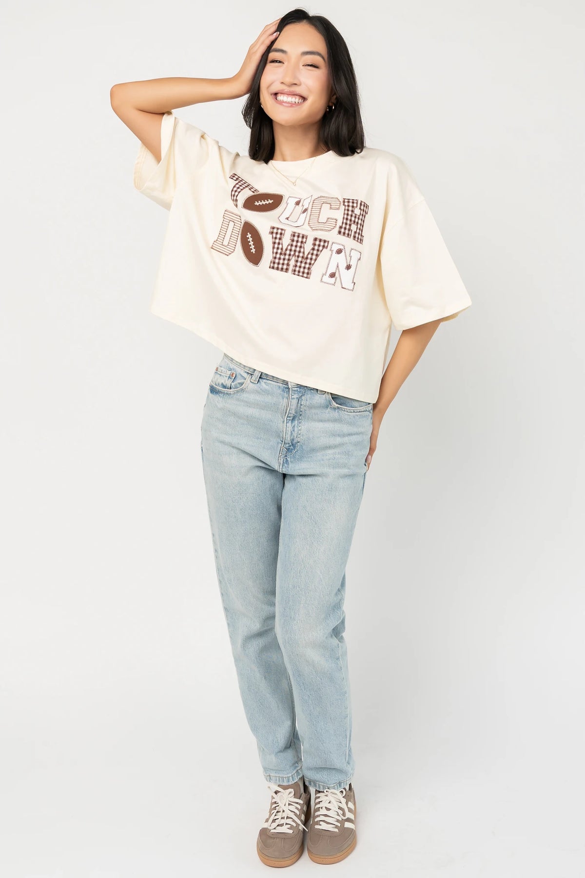 Jason Graphic Tee in Cream with vintage football graphic, gingham, lace and bow appliqué, crew neckline, and short sleeves.