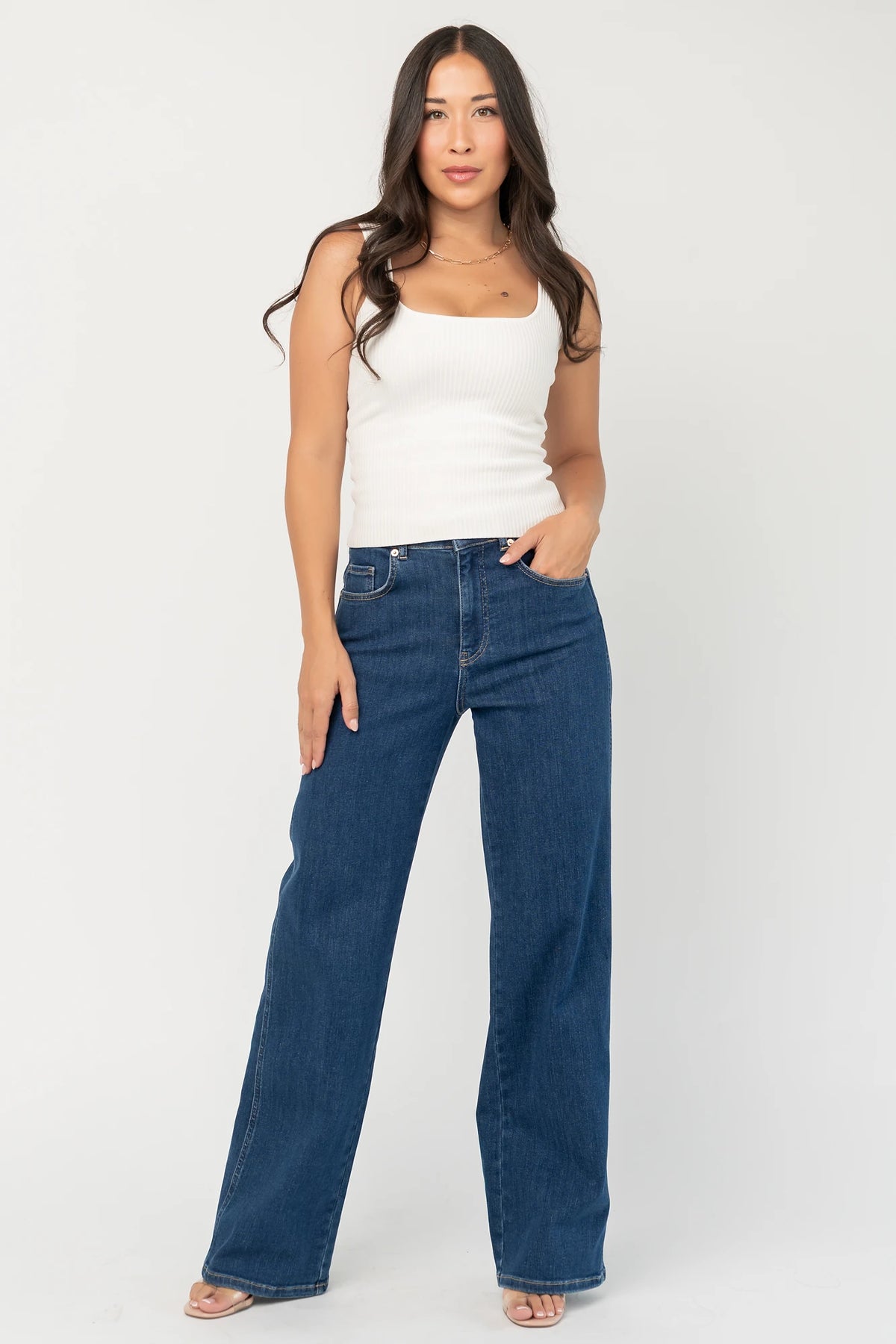 Vesper Mid Rise Wide Leg Jeans in Dark Wash with relaxed wide legs, mid-rise waist, button and zipper closure.