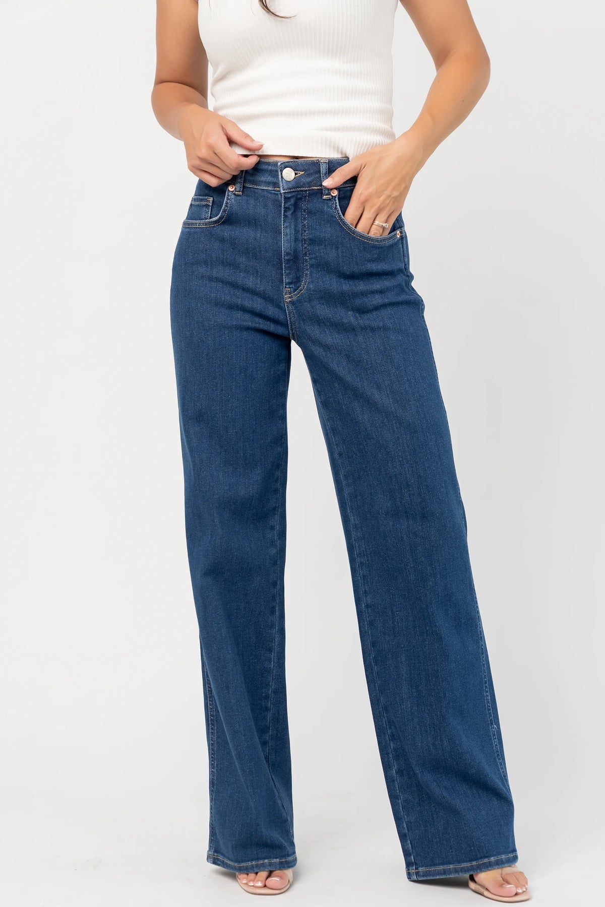 Vesper Mid Rise Wide Leg Jeans in Dark Wash with relaxed wide legs, mid-rise waist, button and zipper closure.