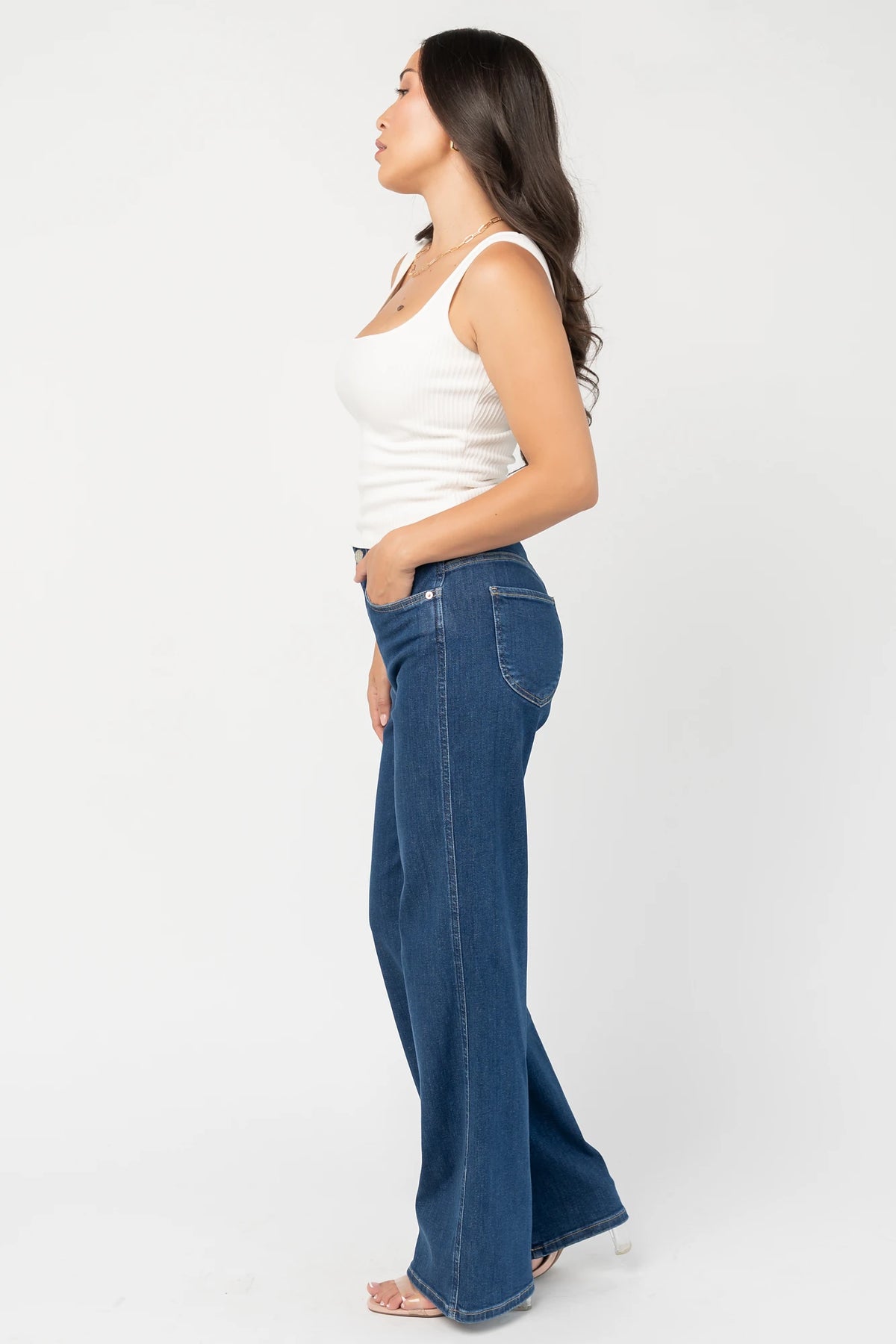 Vesper Mid Rise Wide Leg Jeans in Dark Wash with relaxed wide legs, mid-rise waist, button and zipper closure.