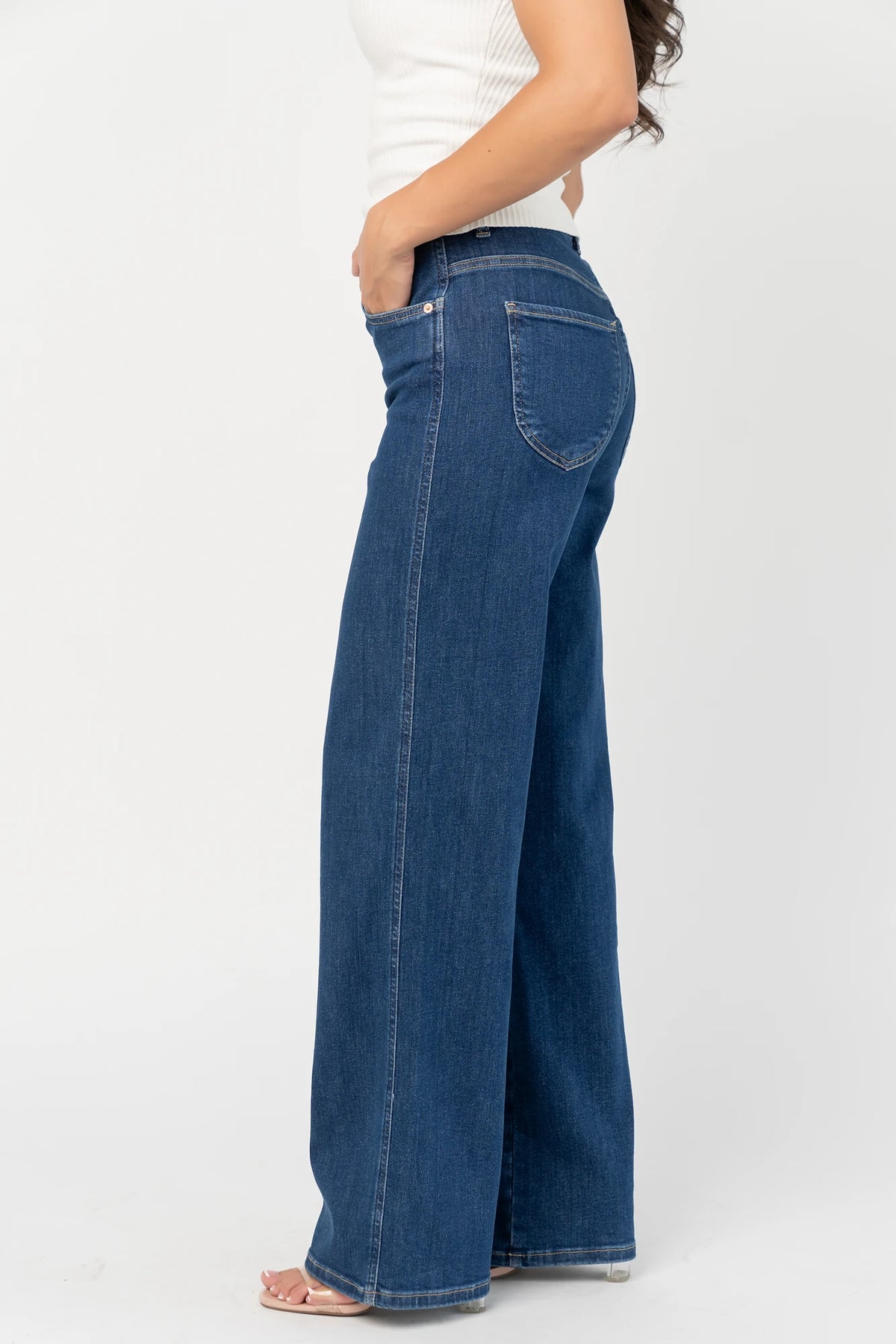 Vesper Mid Rise Wide Leg Jeans in Dark Wash with relaxed wide legs, mid-rise waist, button and zipper closure.