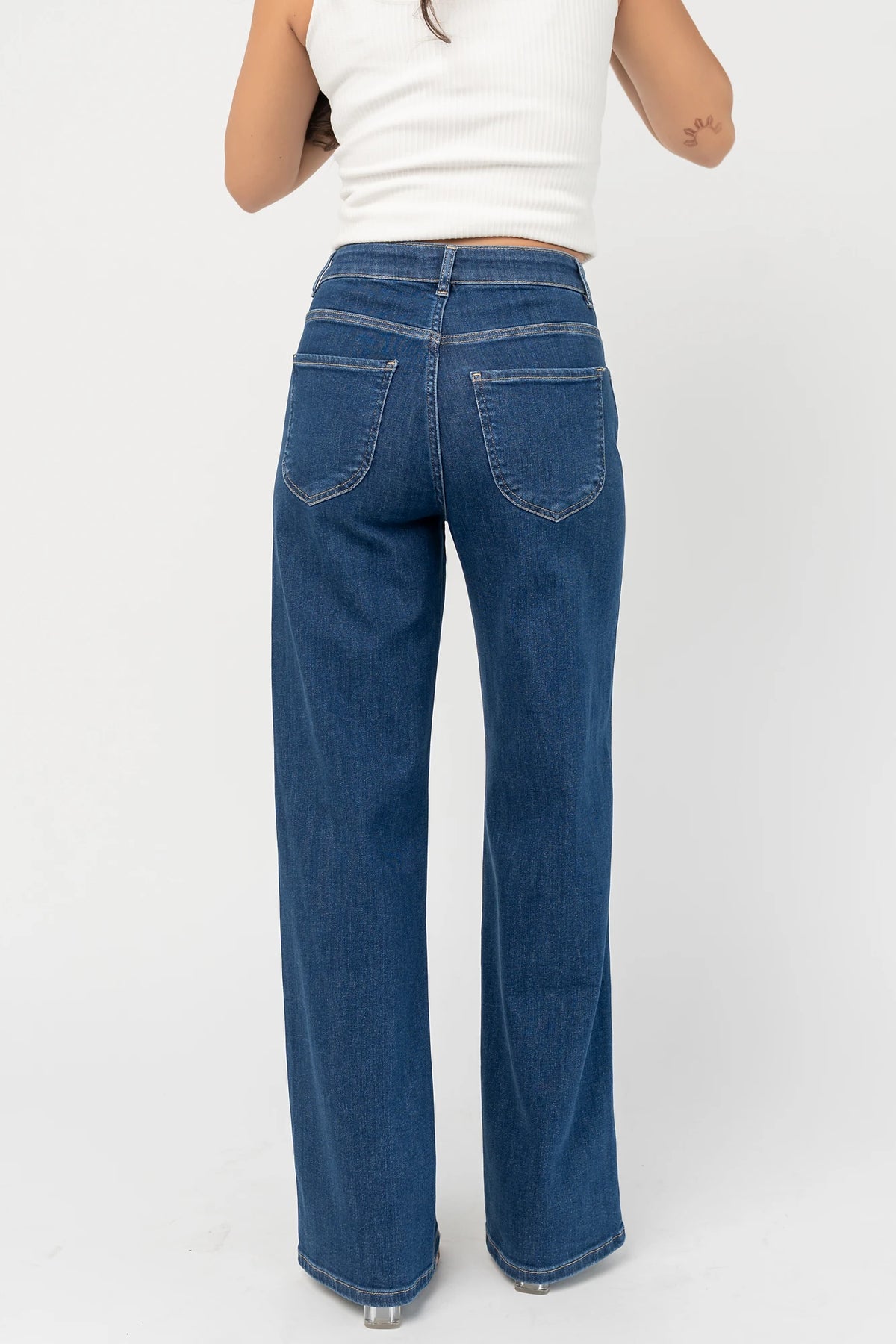 Vesper Mid Rise Wide Leg Jeans in Dark Wash with relaxed wide legs, mid-rise waist, button and zipper closure.