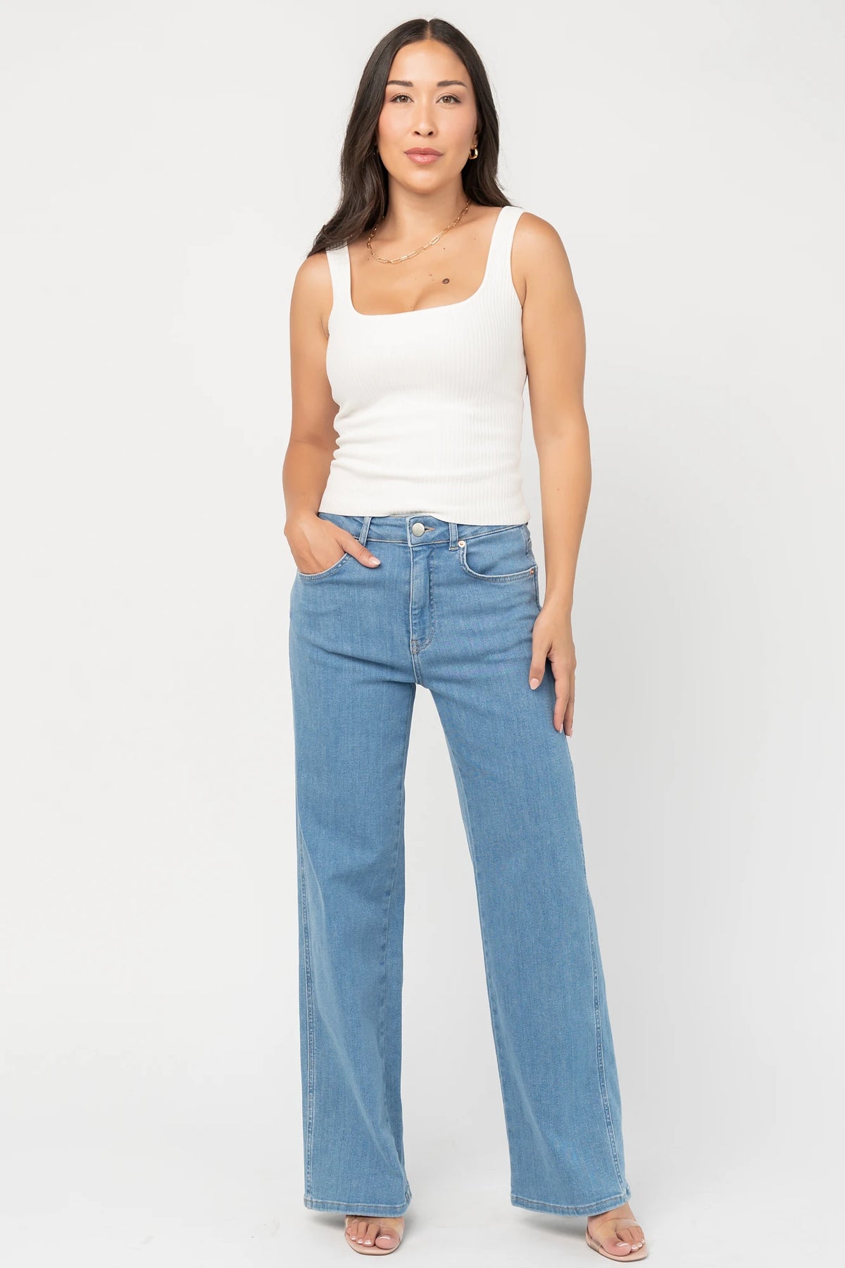 Vesper Mid Rise Wide Leg Jeans in Mid Wash with relaxed wide legs, mid-rise waist, button and zipper closure.