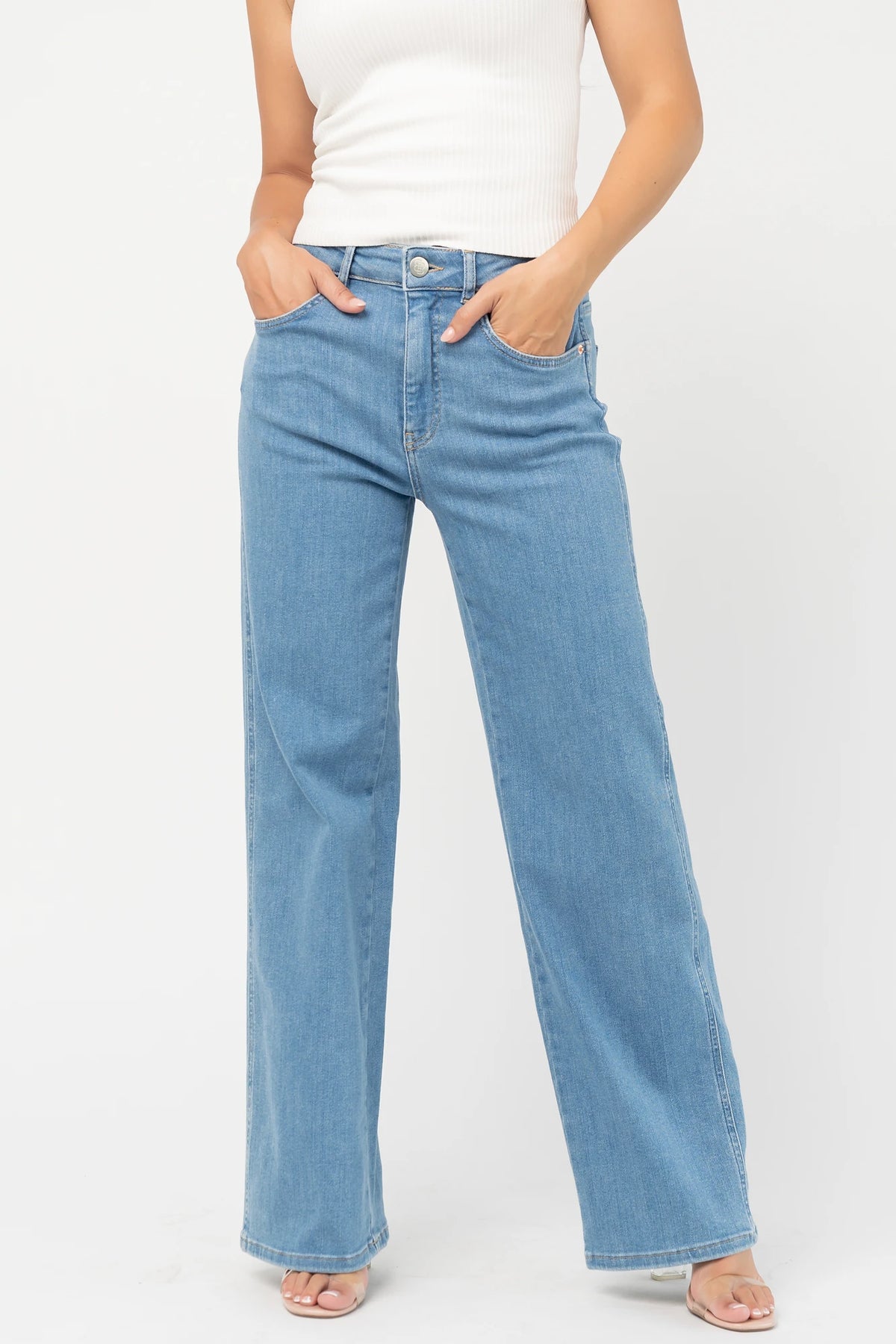 Vesper Mid Rise Wide Leg Jeans in Mid Wash with relaxed wide legs, mid-rise waist, button and zipper closure.