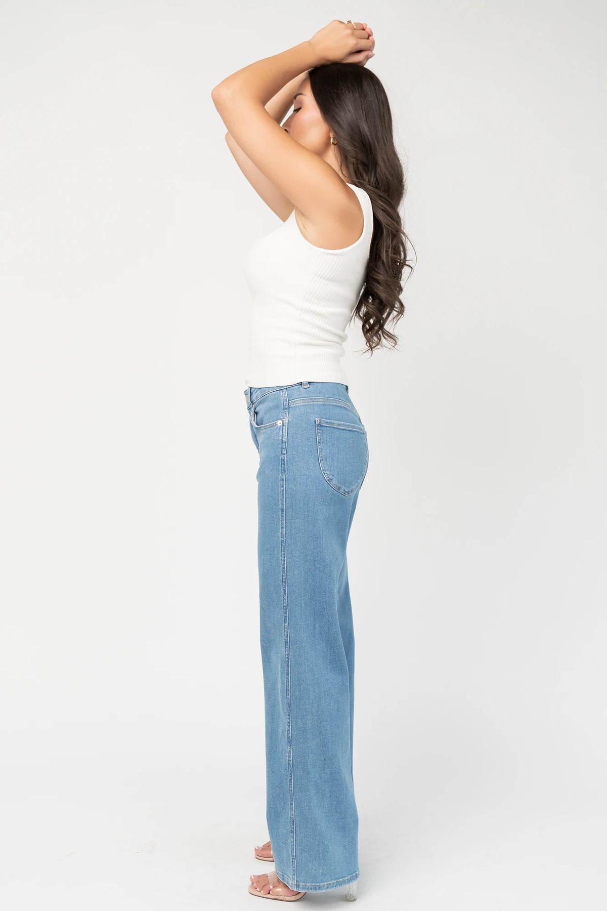 Vesper Mid Rise Wide Leg Jeans in Mid Wash with relaxed wide legs, mid-rise waist, button and zipper closure.