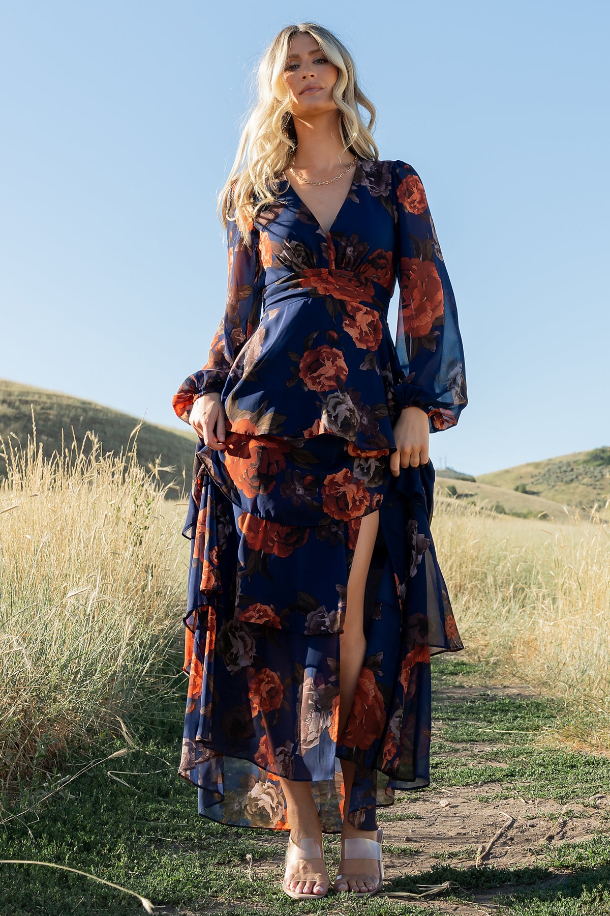 Close-up of Mariella dress bodice in navy + rust floral chiffon highlighting pleated underbust panel, V-neckline, and delicate fabric texture.