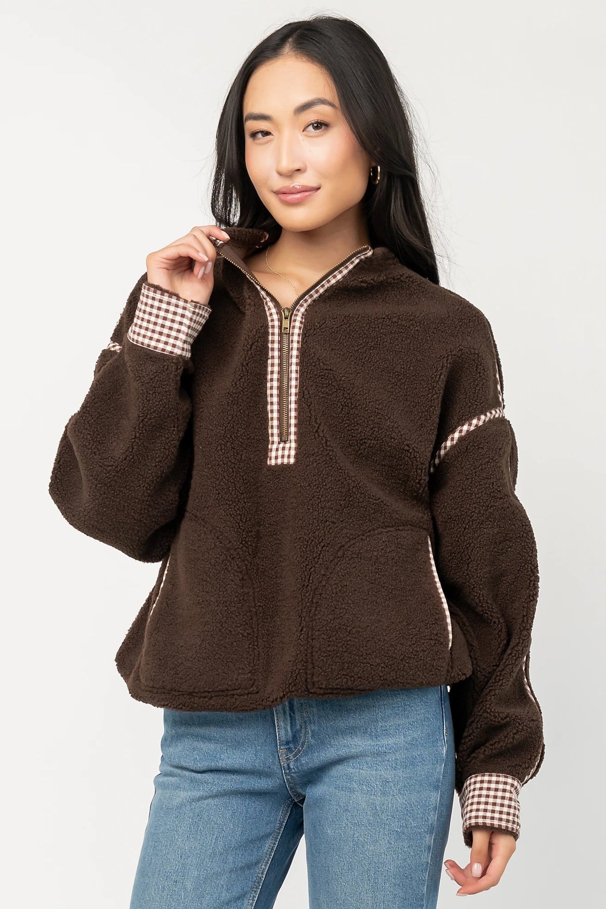 Tylee Fleece Jacket in Chocolate with sherpa fleece, half-zip neckline, brown gingham trim, fold-over cuffs, and side pockets.