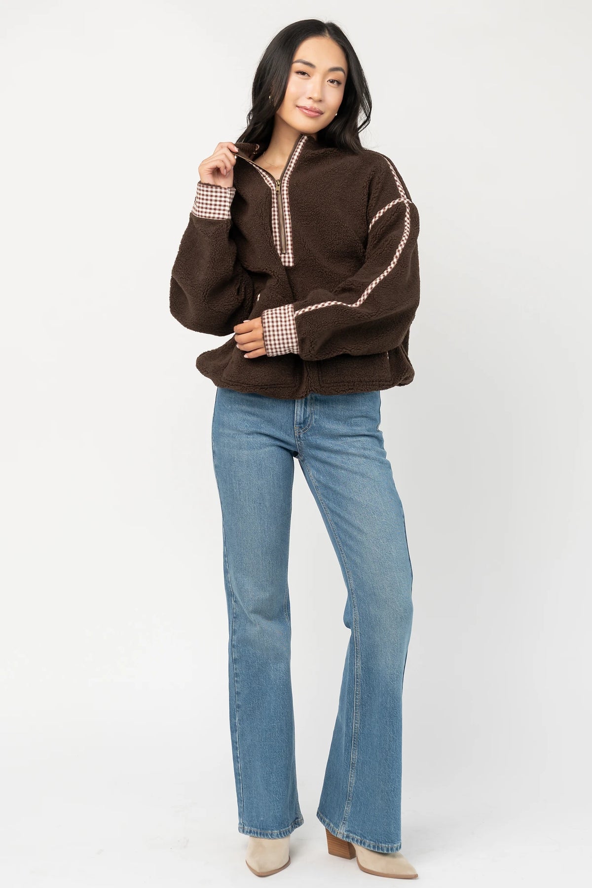 Tylee Fleece Jacket in Chocolate with sherpa fleece, half-zip neckline, brown gingham trim, fold-over cuffs, and side pockets.