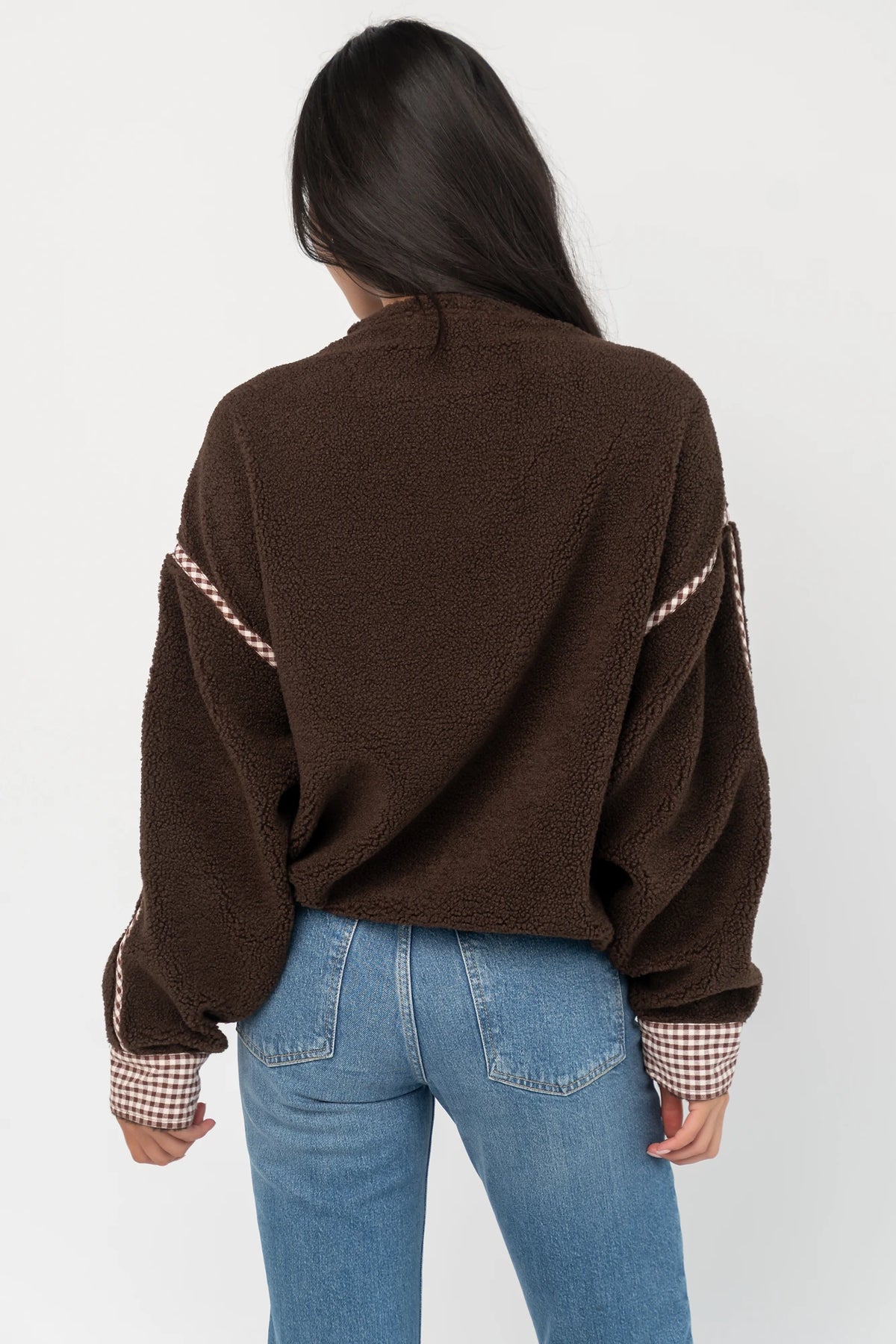Tylee Fleece Jacket in Chocolate with sherpa fleece, half-zip neckline, brown gingham trim, fold-over cuffs, and side pockets.