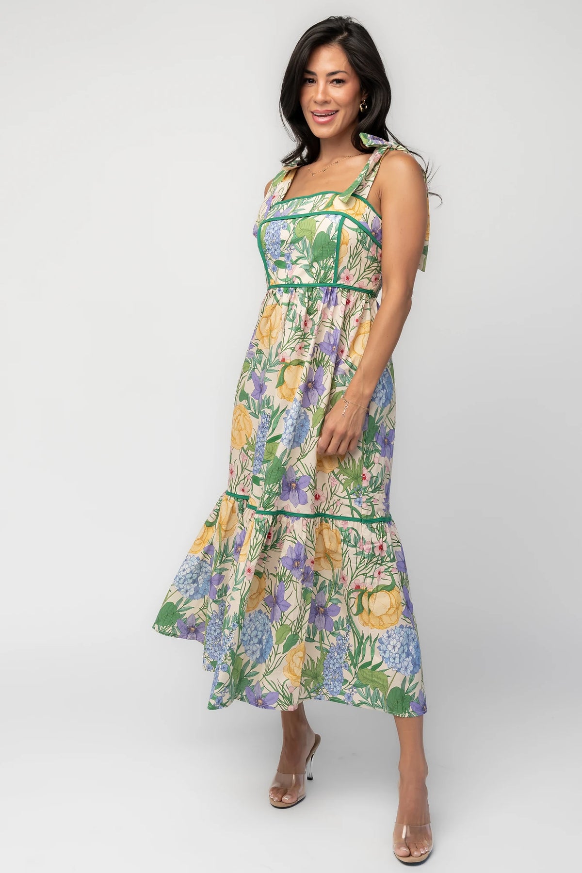Model wearing the Torres Midi Dress featuring a multicolor floral print with green accents.