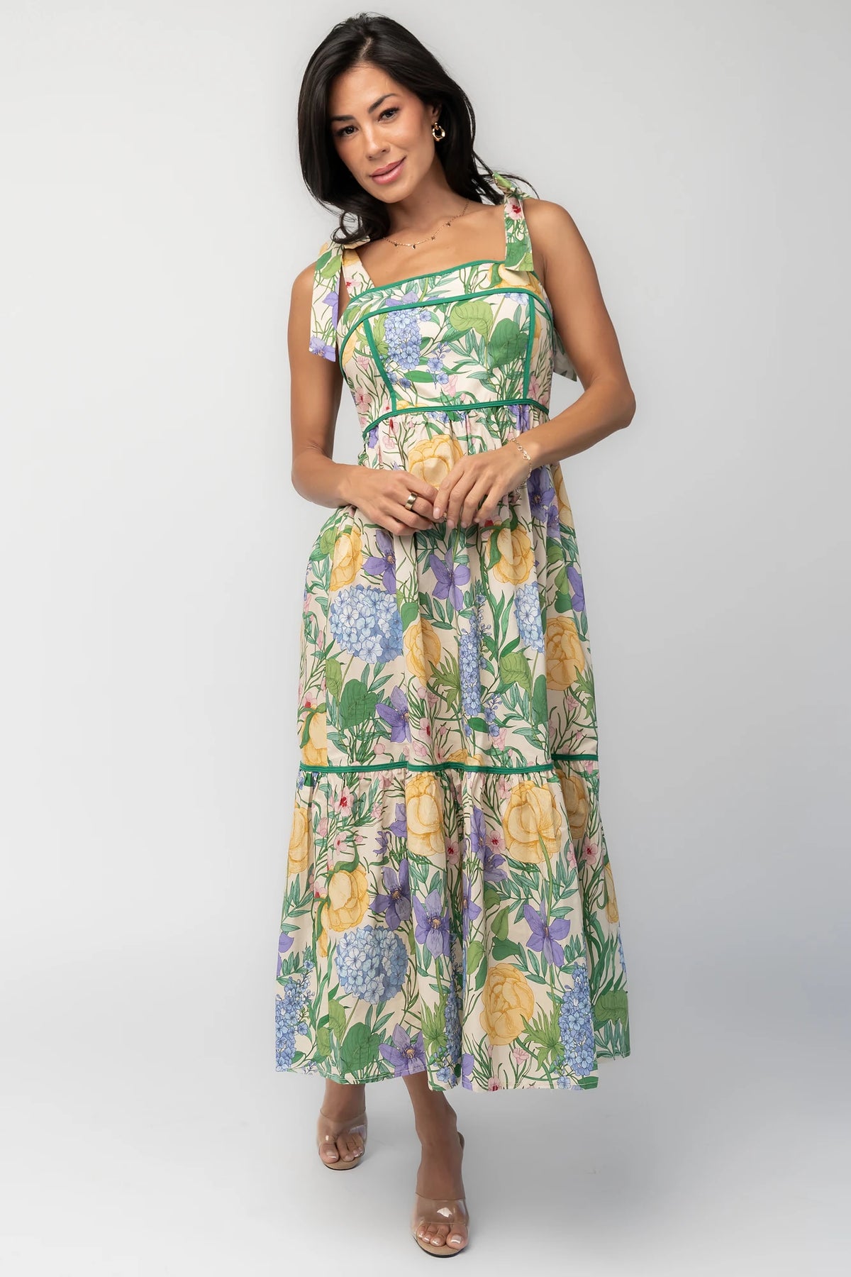 Model wearing the Torres Midi Dress featuring a multicolor floral print with green accents.