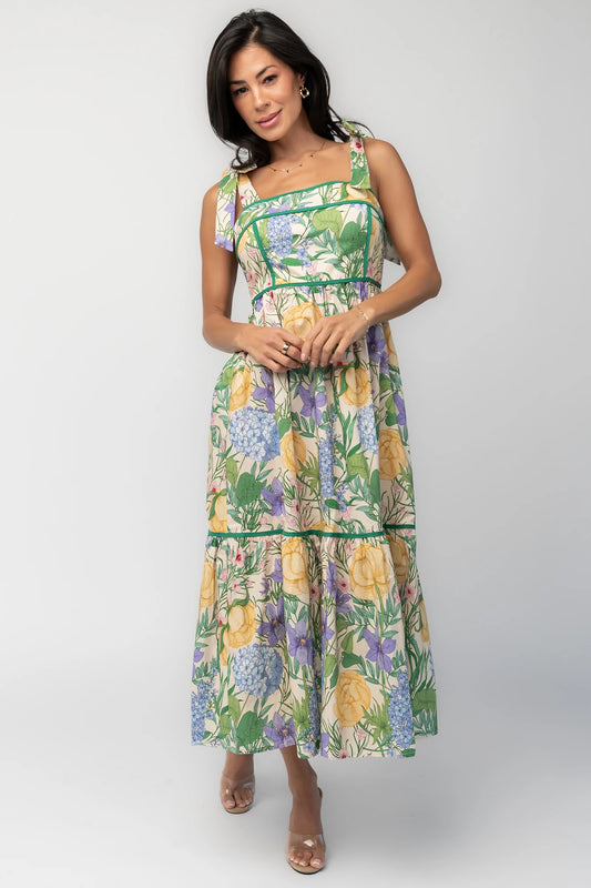 Model wearing the Torres Midi Dress featuring a multicolor floral print with green accents.