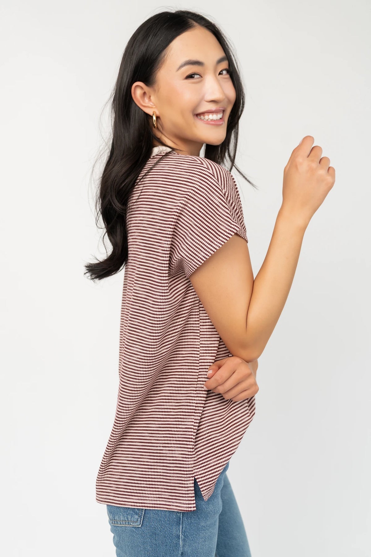 Millie Striped Top in Burgundy + Ivory with round neckline, short sleeves, side slits, and asymmetrical hem.