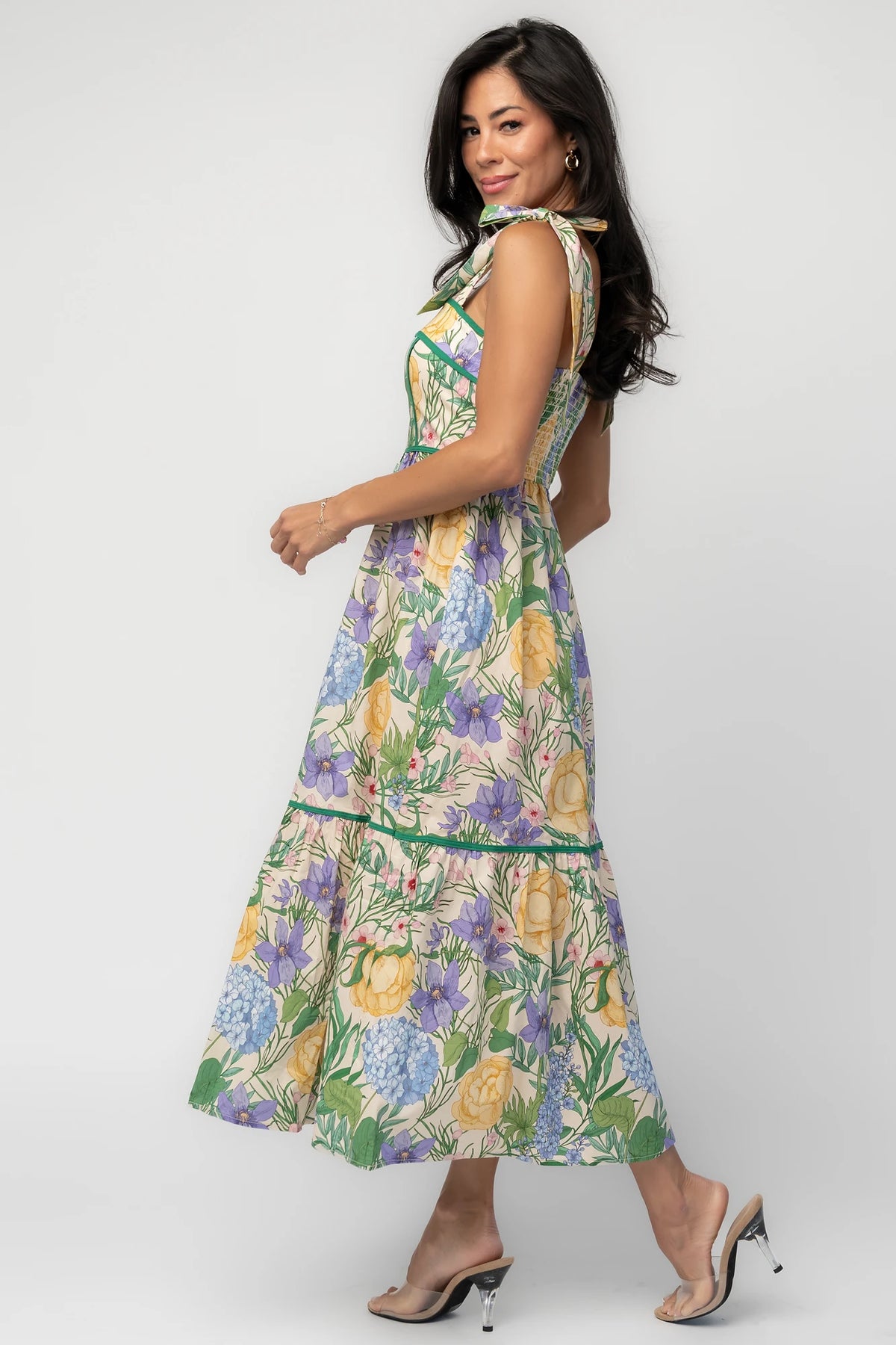 Model wearing the Torres Midi Dress featuring a multicolor floral print with green accents.