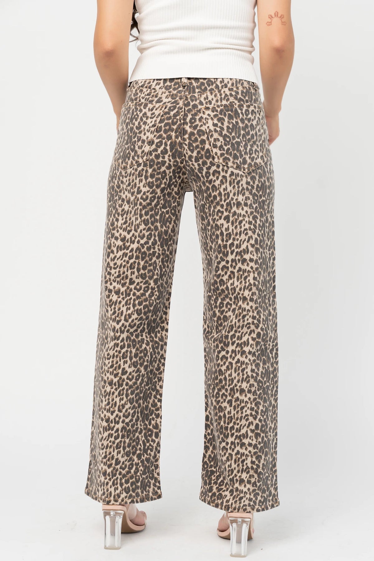 Leopard Print Wide Leg Pants with high-rise waist, button and zip closure, belt loops, and front and back pockets.