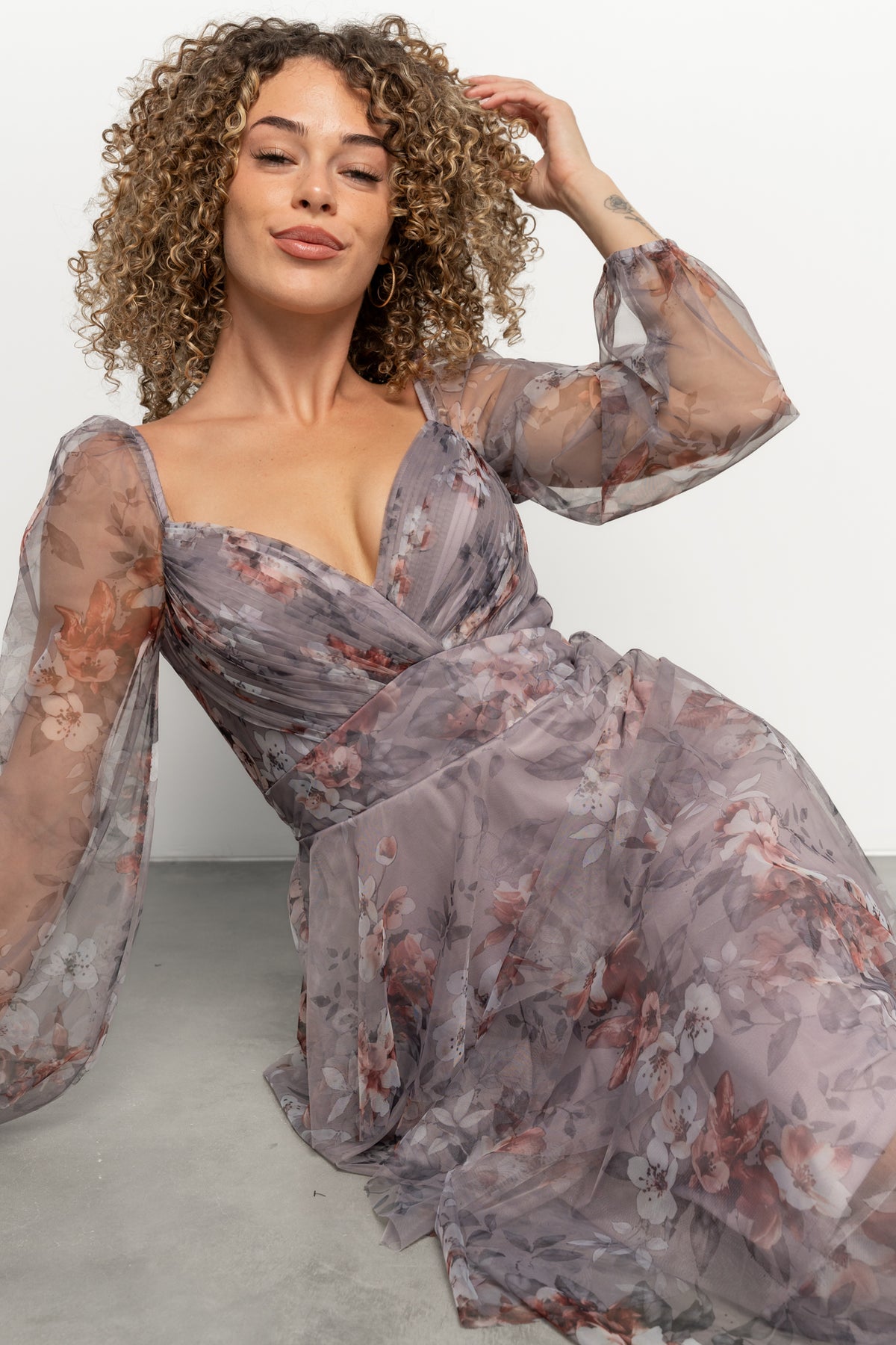 Back view of Tessa maxi dress in lilac gray floral showing V-back, elasticized back waist panel, and tiered tulle skirt.