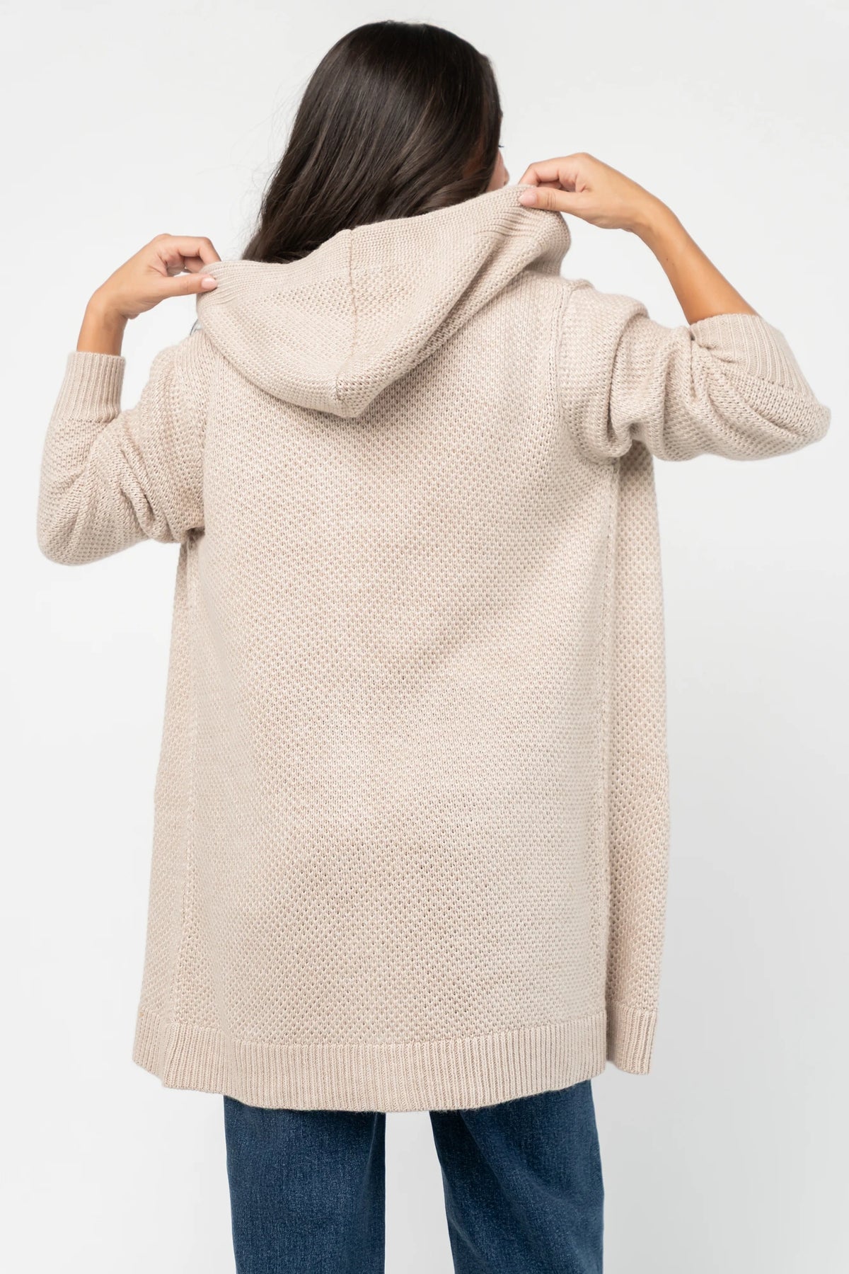 Katrine Hooded Cardigan with chunky knit, oversized fit, four-button front, patch pockets, and ribbed trim.