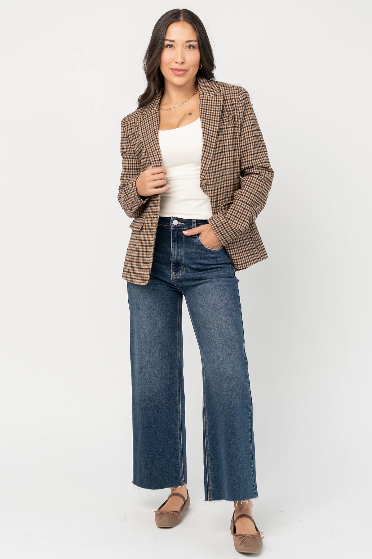 Damien Plaid Blazer in black and camel plaid with tailored waist, two-button front, flap pockets, and long sleeves.